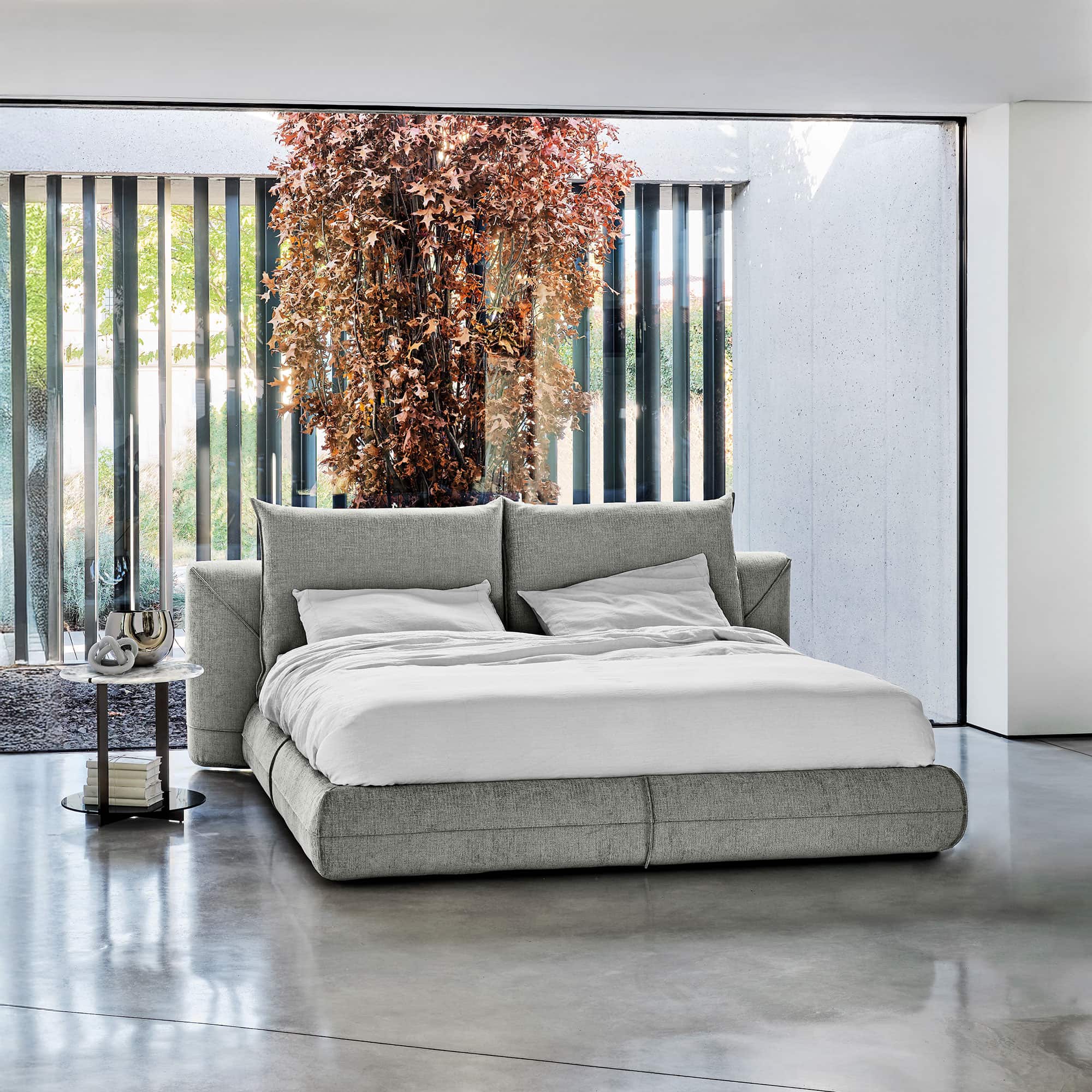 Starman Dream Bed in modern bedroom with large window and natural light, styled with accent pillows.