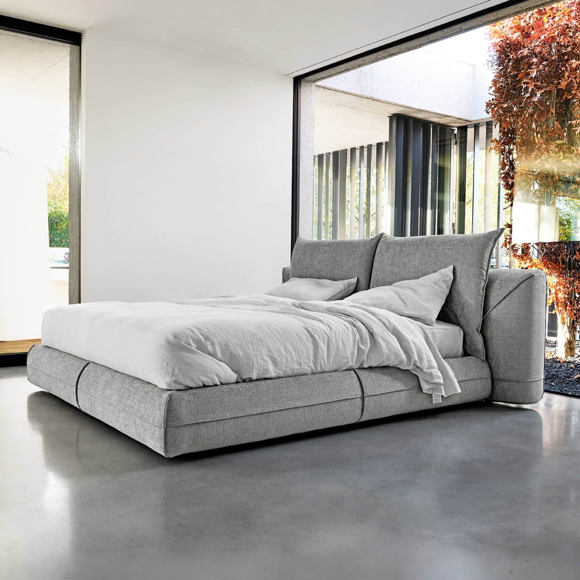 Starman Dream Upholstered Platform Bed with light fabric upholstery in a minimalist bedroom setting.