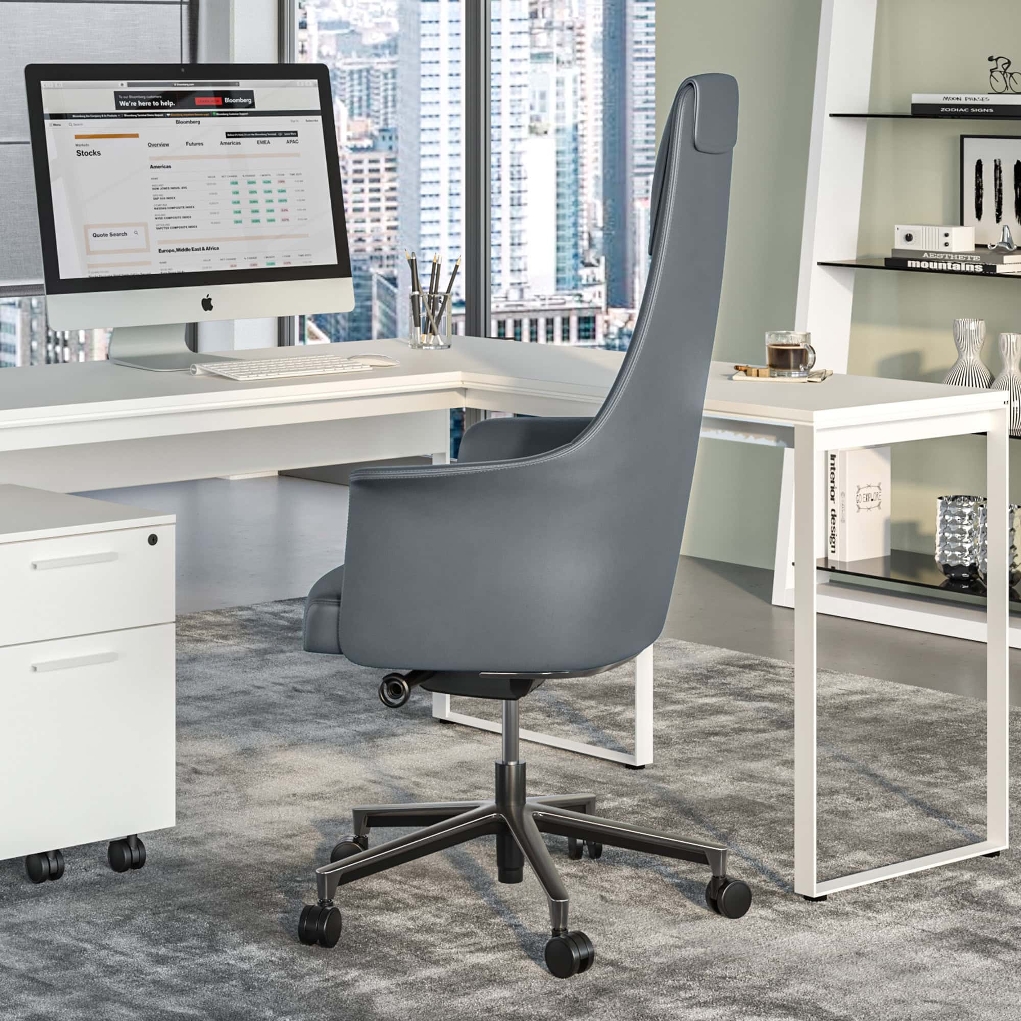 a chair in a room with a desk and a computer