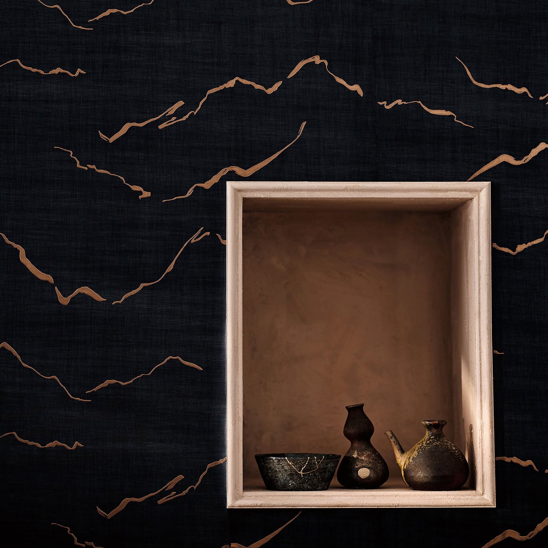 Close-up of Kuju Textured Metallic Wallpaper in Shadow, showing bold black ground with shimmering metallic streaks.