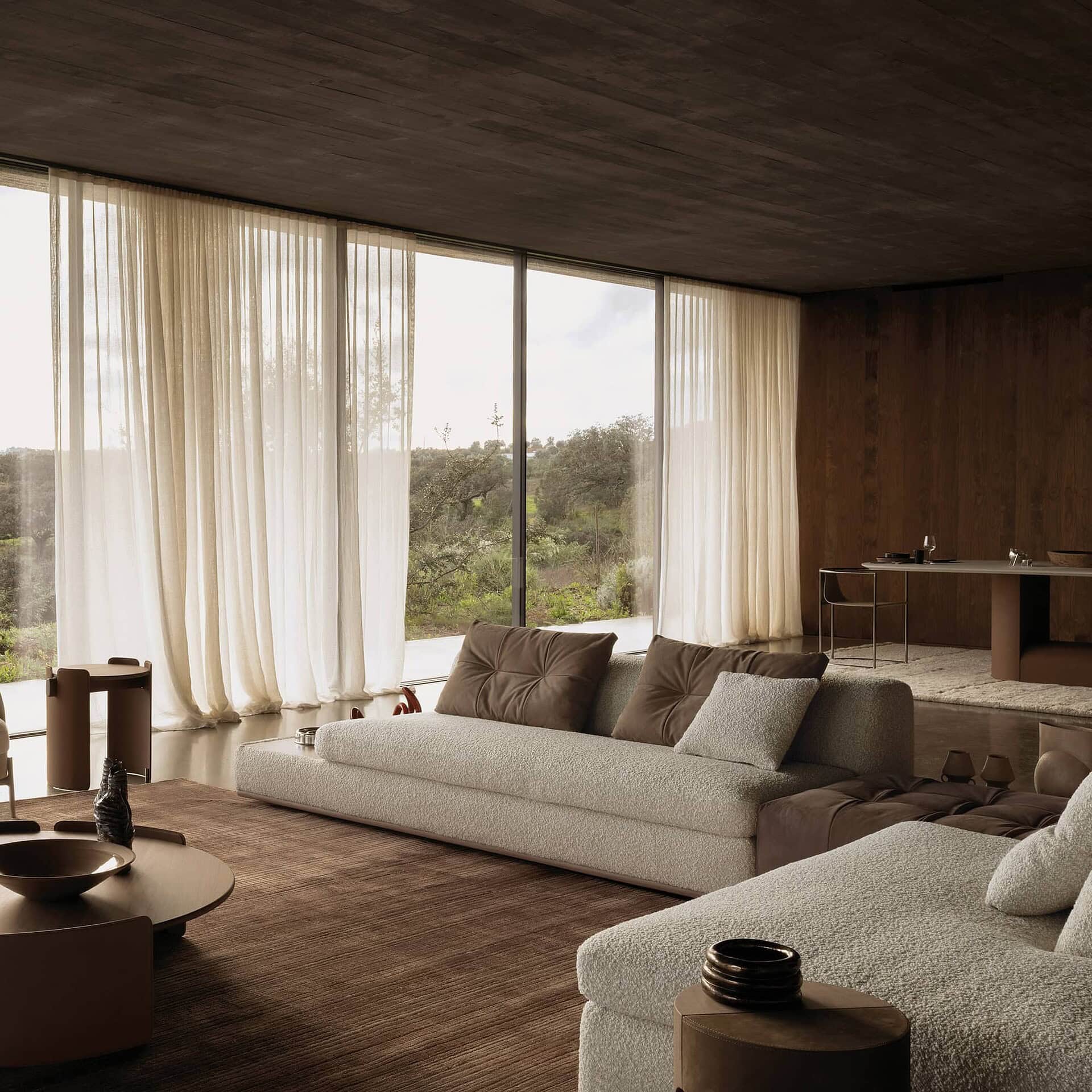 Montgomery Sectional Sofa with large chaise lounge facing floor-to-ceiling windows