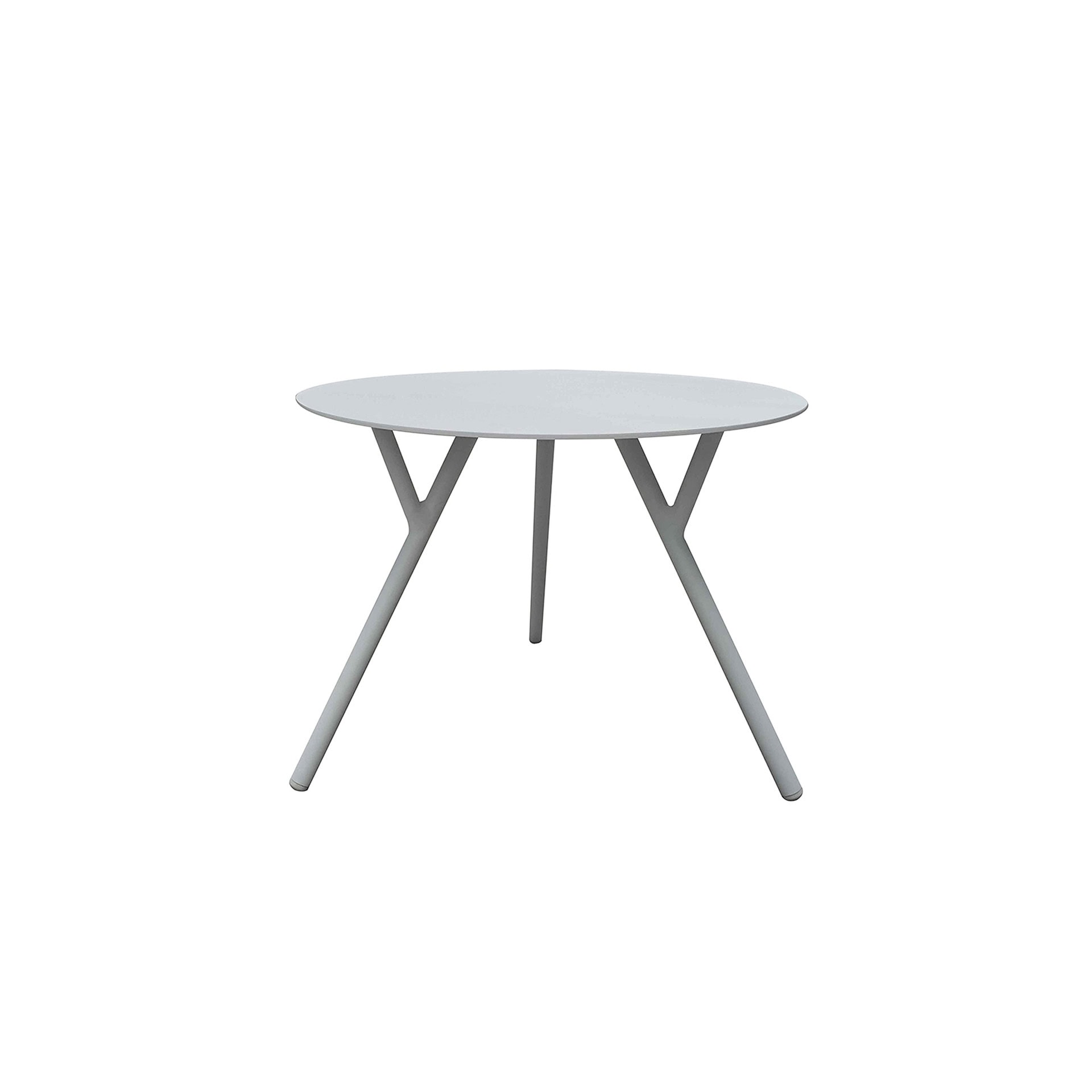 White round dining table with sleek legs, perfect for modern home or office spaces.
