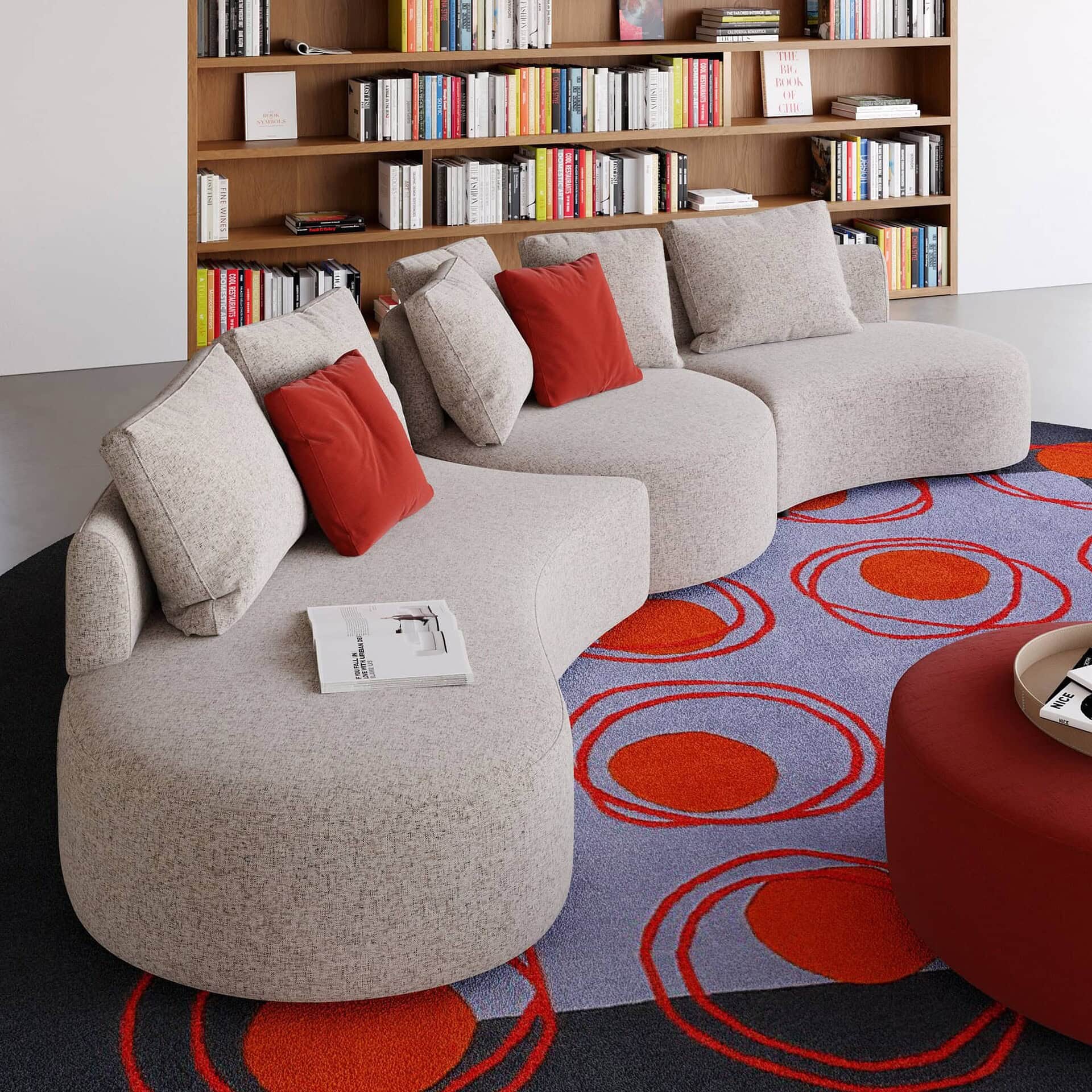 Jean Sectional showing smooth sculptural curves and soft fabric upholstery in a neutral tone.