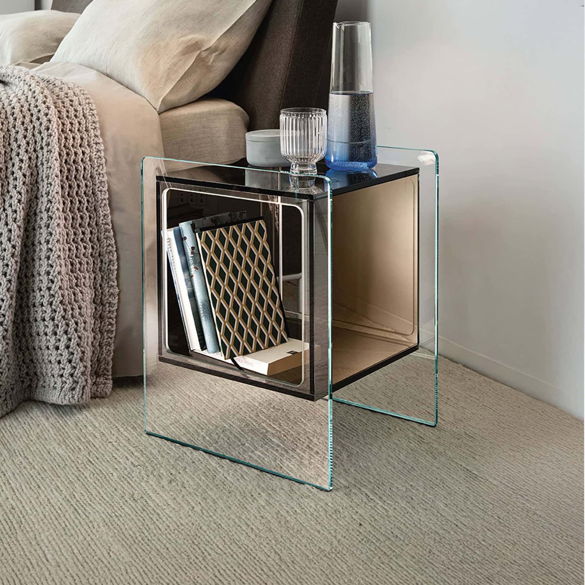 Modern glass nightstand with open storage, perfect for bedroom decor.