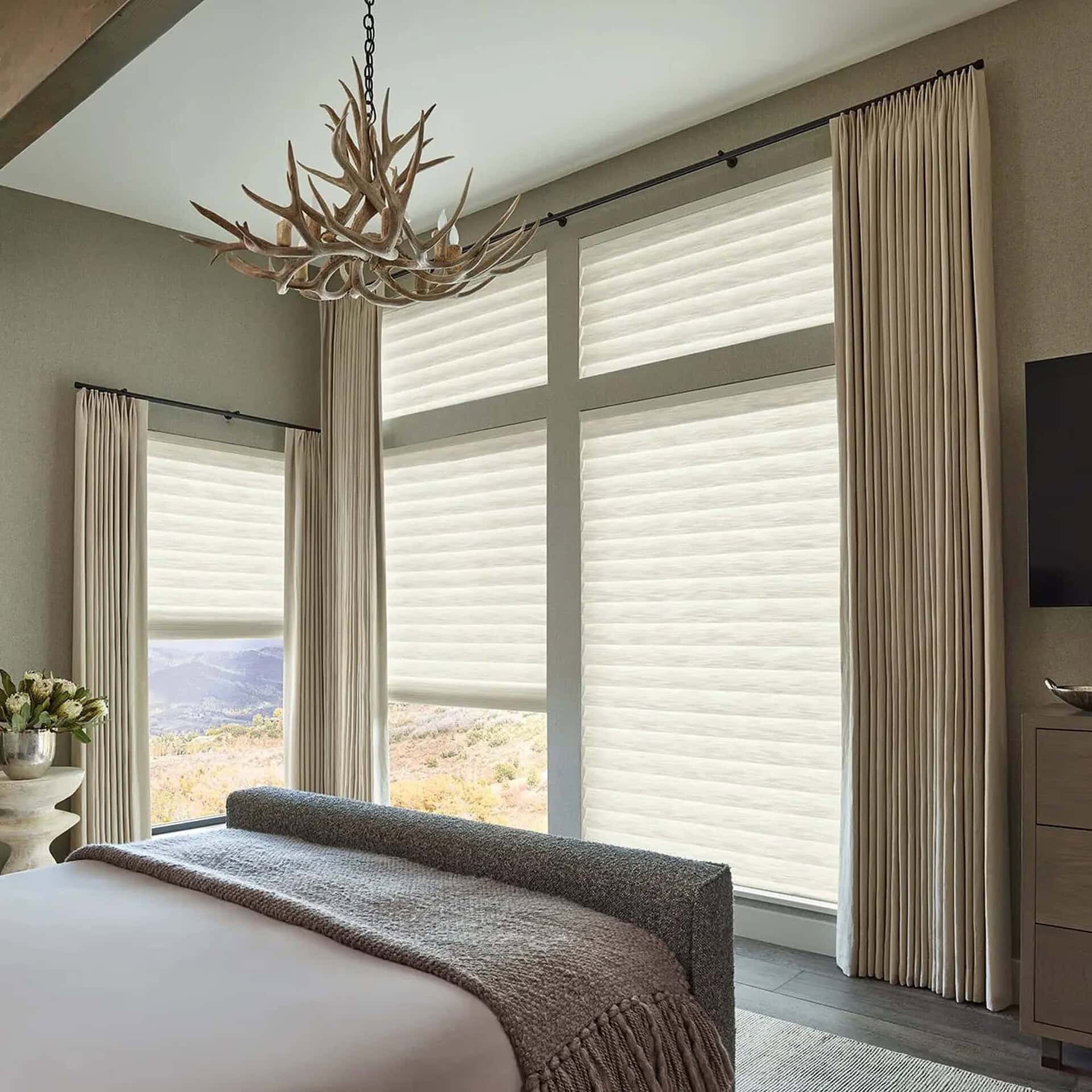 a bedroom with a bed and a tv