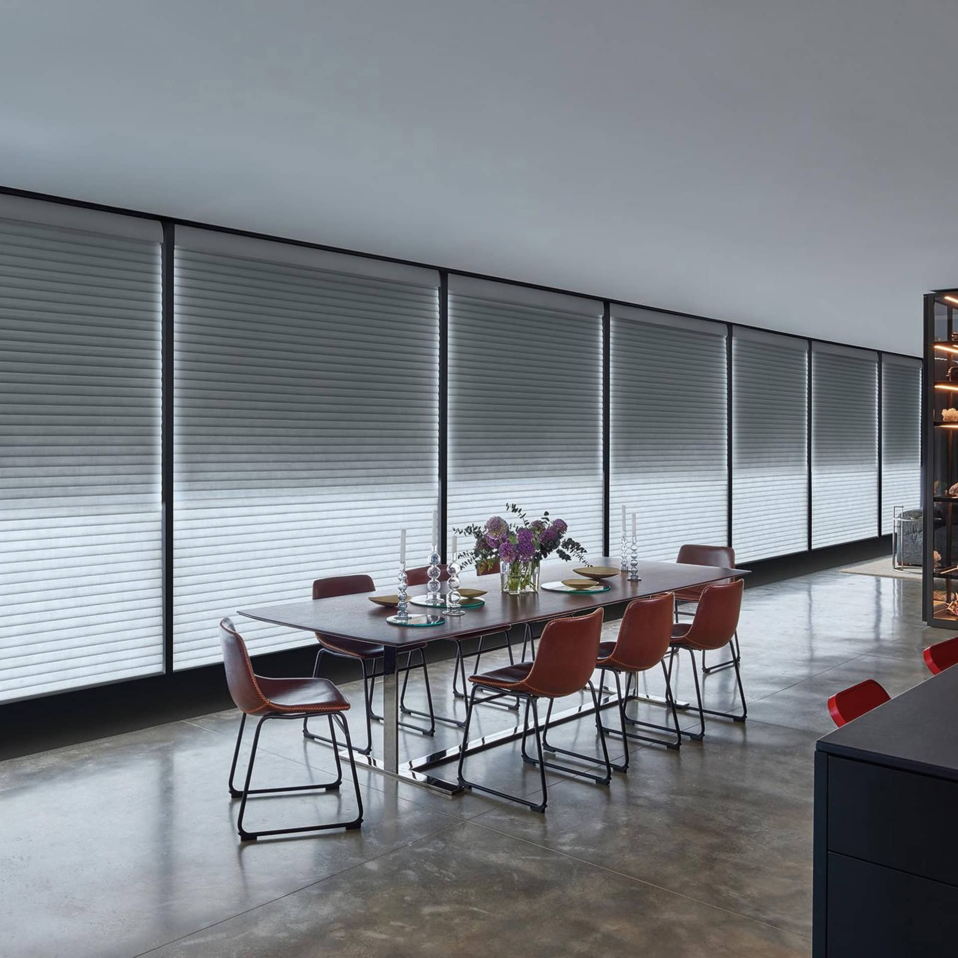 a dining table with chairs in a room with blinds