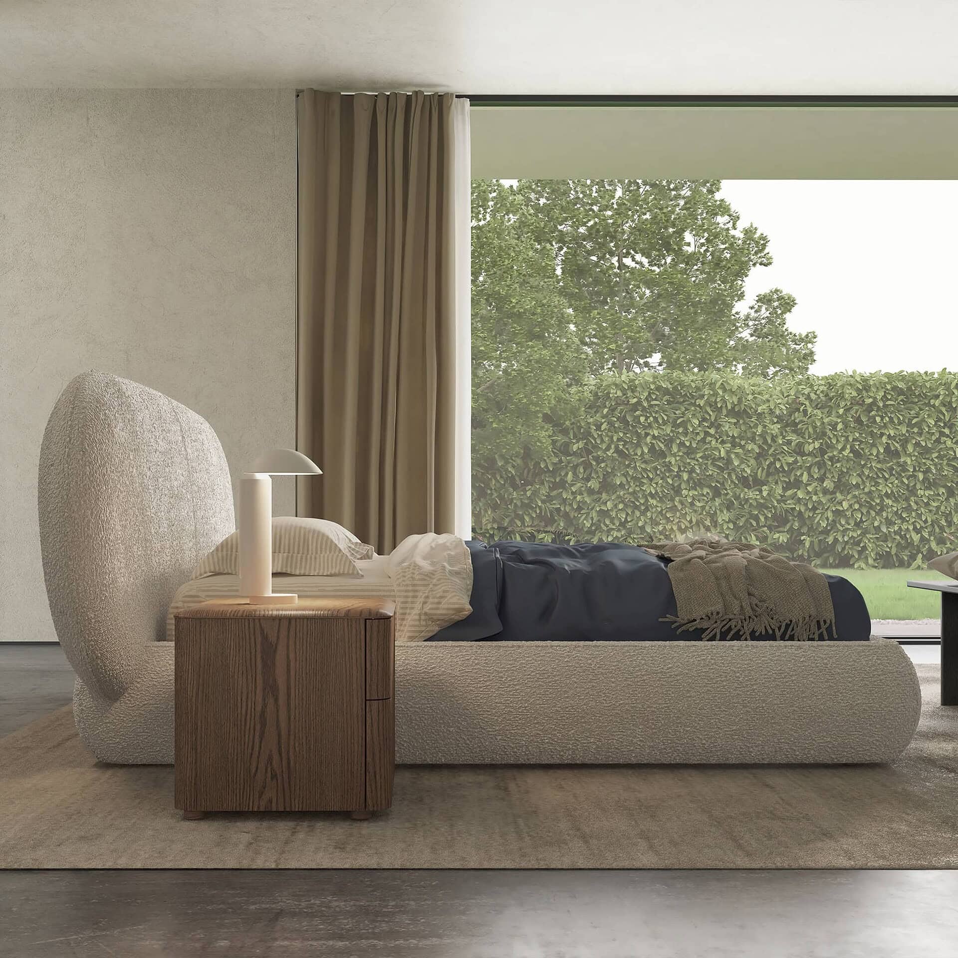 Side view of Huppé Simone Upholstered Bed with curved headboard and wood nightstand