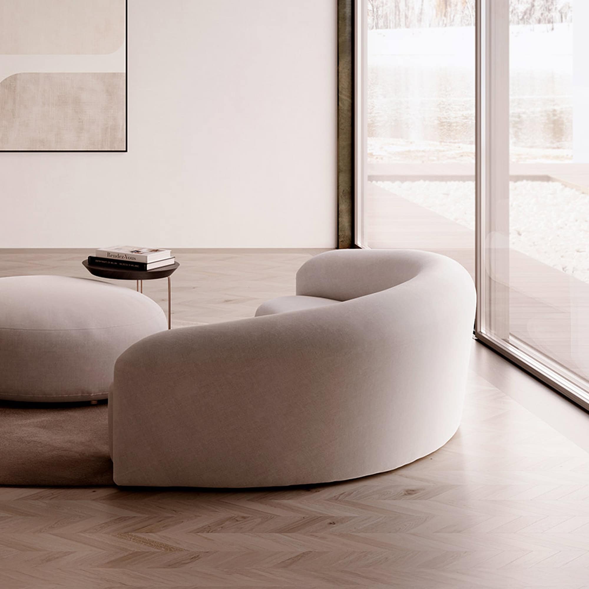 Quentin Curved Upholstered Sofa positioned by large windows with minimalist styling.