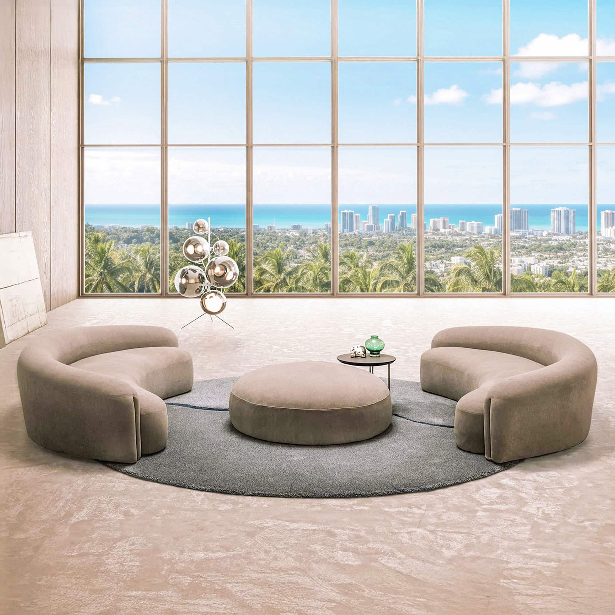 Quentin Curved Upholstered Sofa in a modern living room with large windows and circular layout.