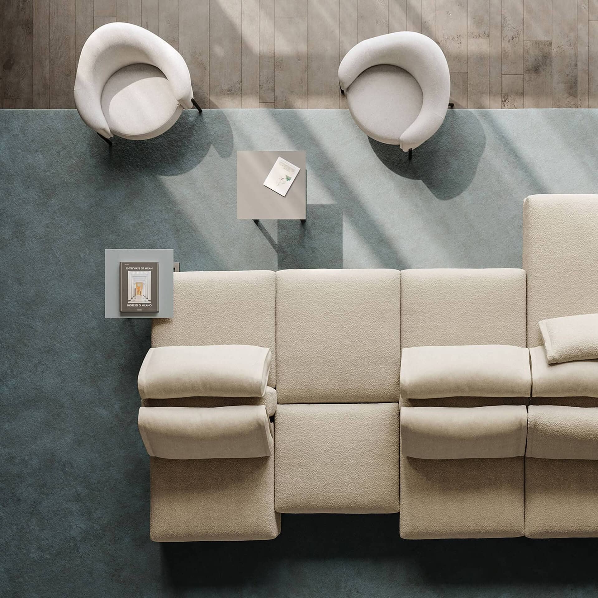Overhead view of Quentin Upholstered Armchairs paired with a sectional sofa in a neutral-toned space.