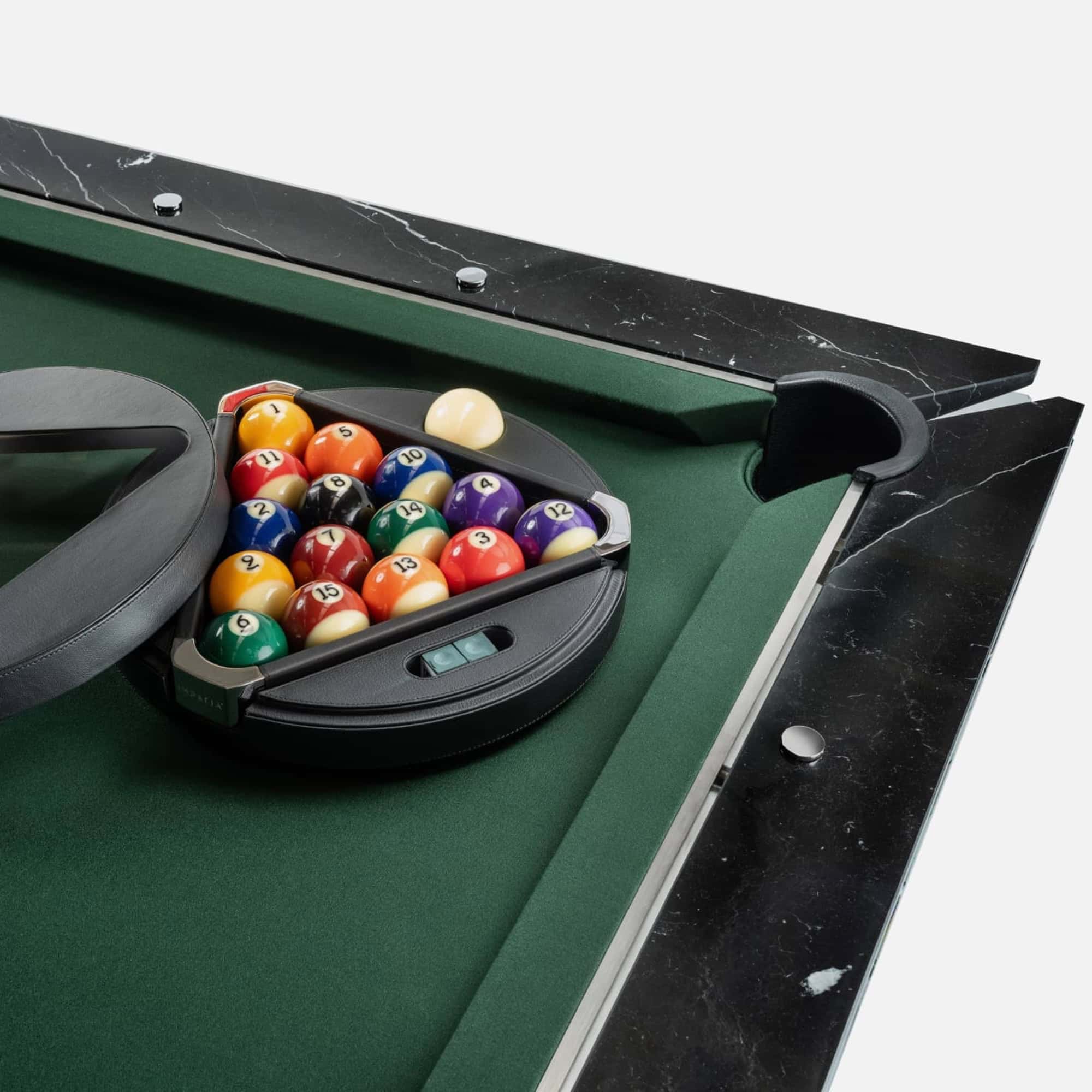 1. Custom pool table with black marble accents and green felt for elegant game rooms.