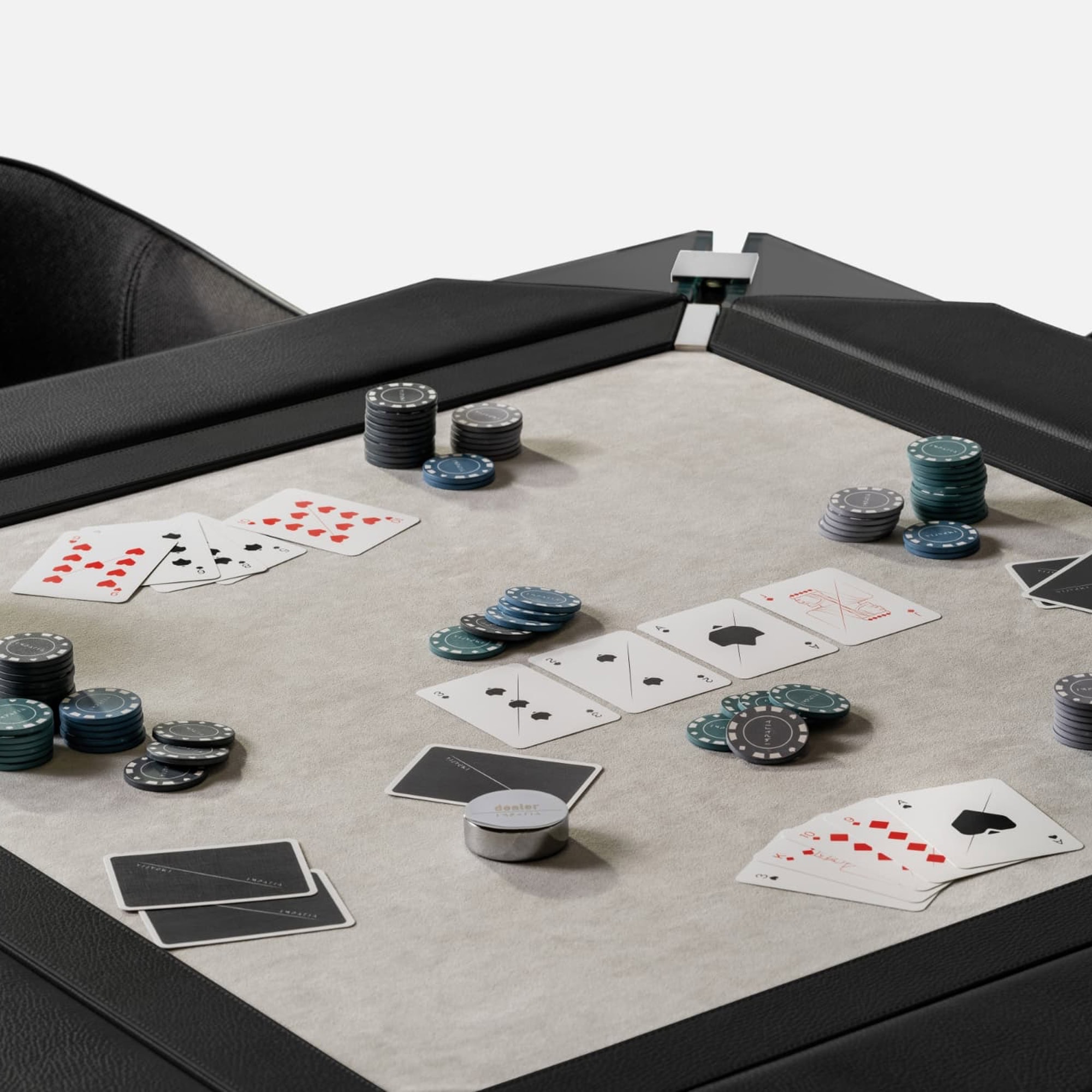 Luxurious black leather poker table with chips and playing cards for upscale gaming nights.