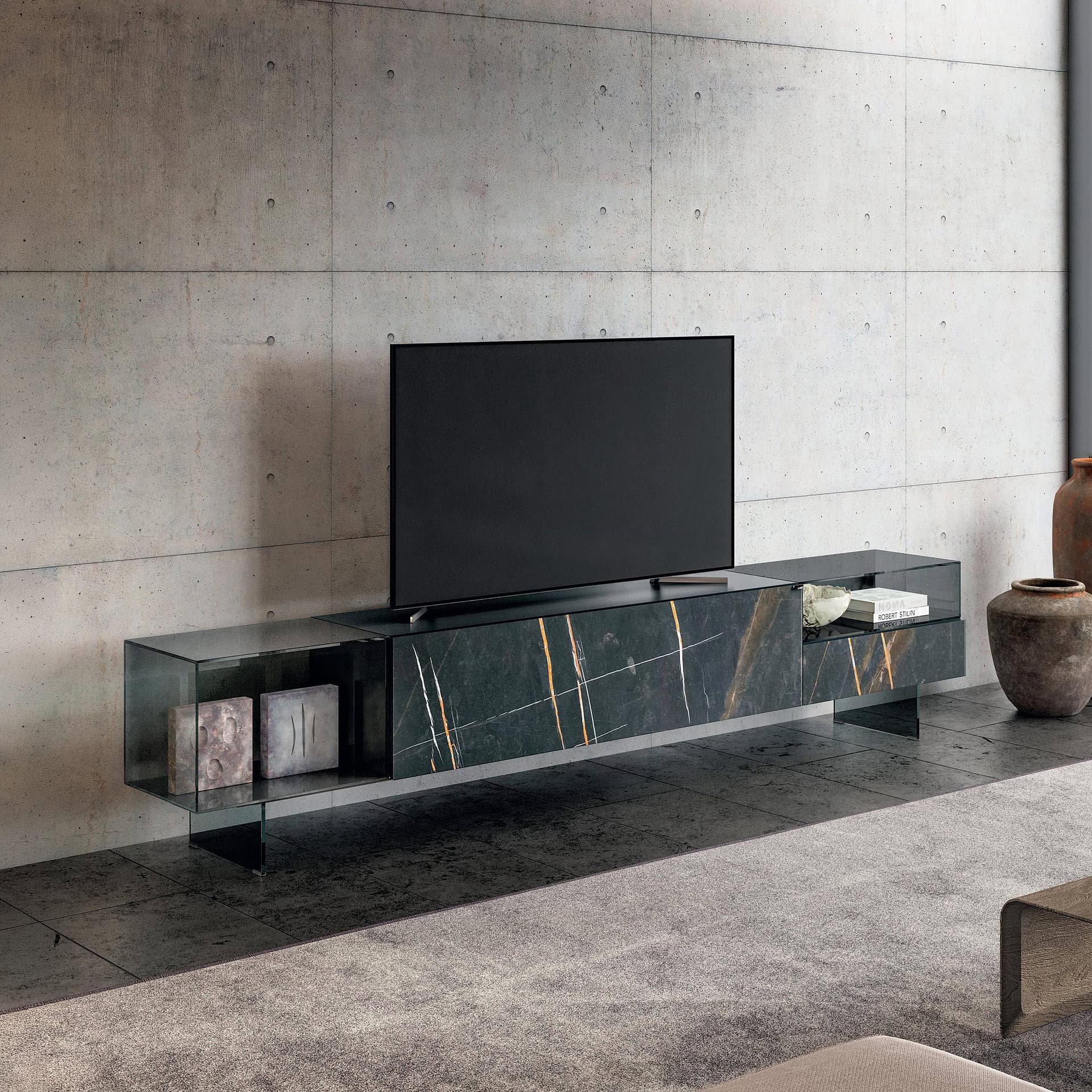 Sleek black marble TV console with minimalist design and decorative accents.