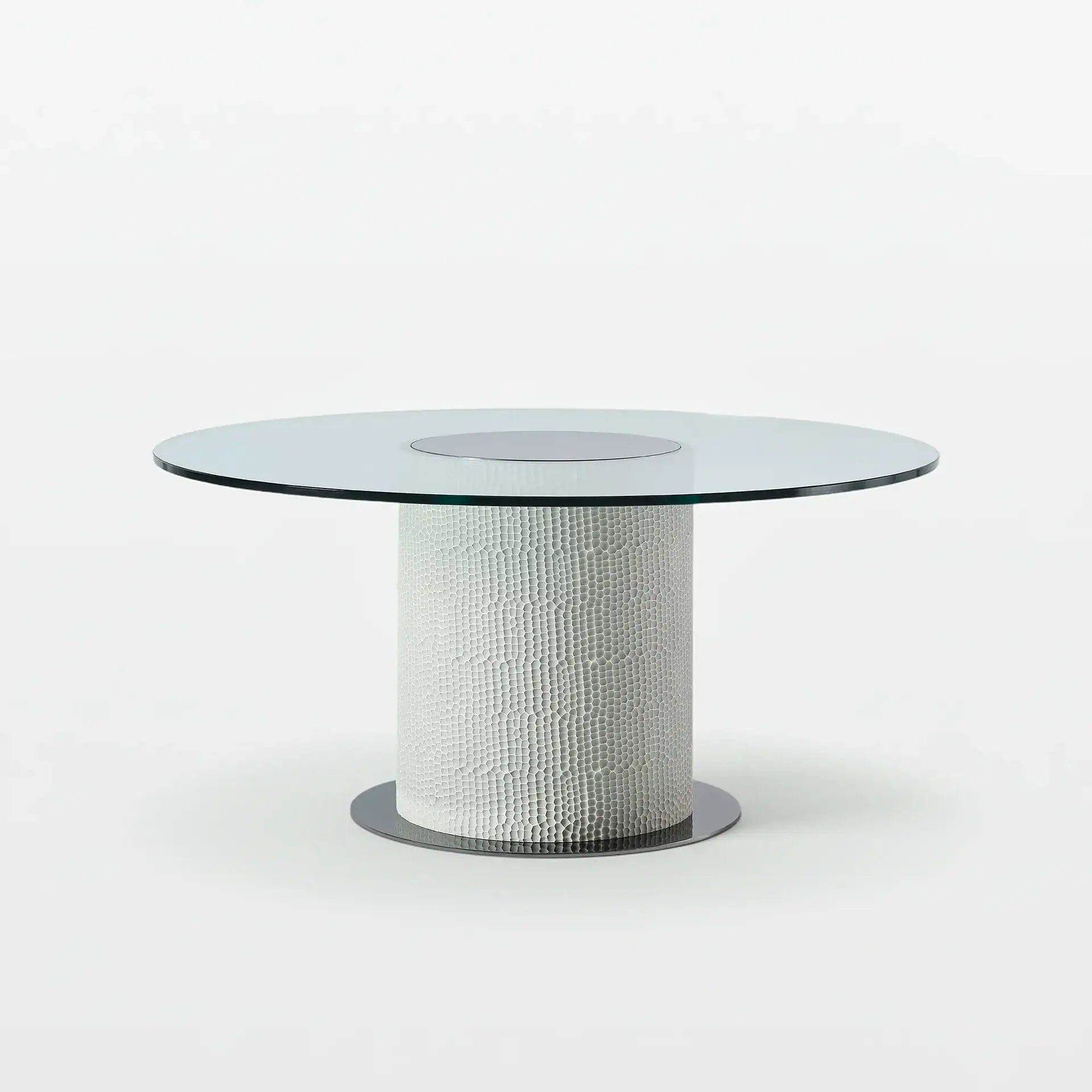 Modern Sahara round glass dining table with textured base, perfect for contemporary dining rooms.