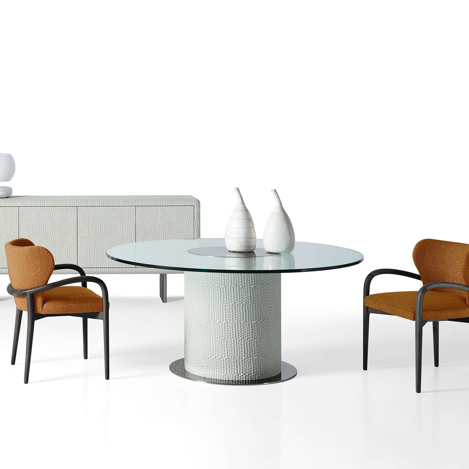 Dining room setting featuring Sahara Round Glass Dining Table with four chairs