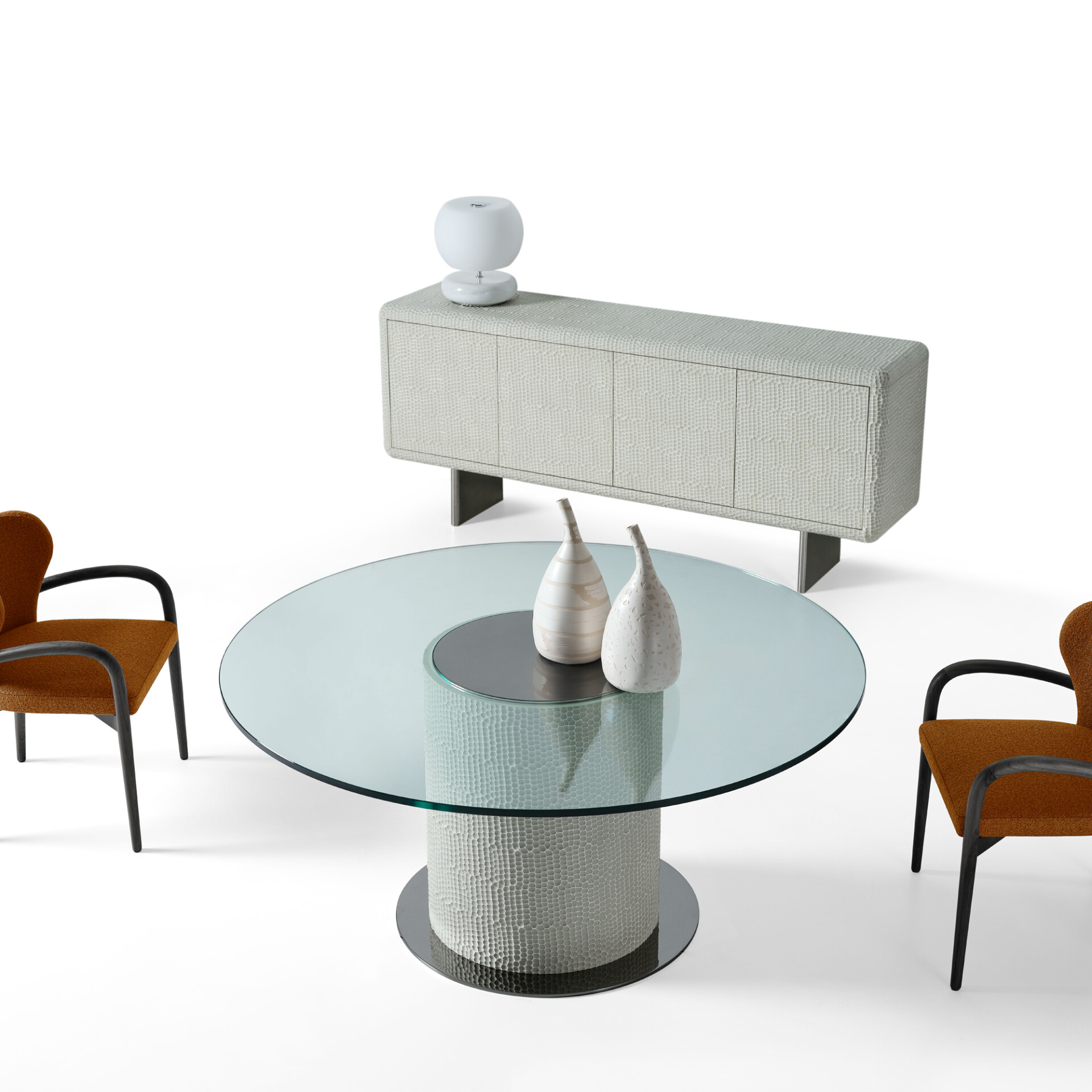 Sahara Round Glass Dining Table styled with vases and matching sideboard