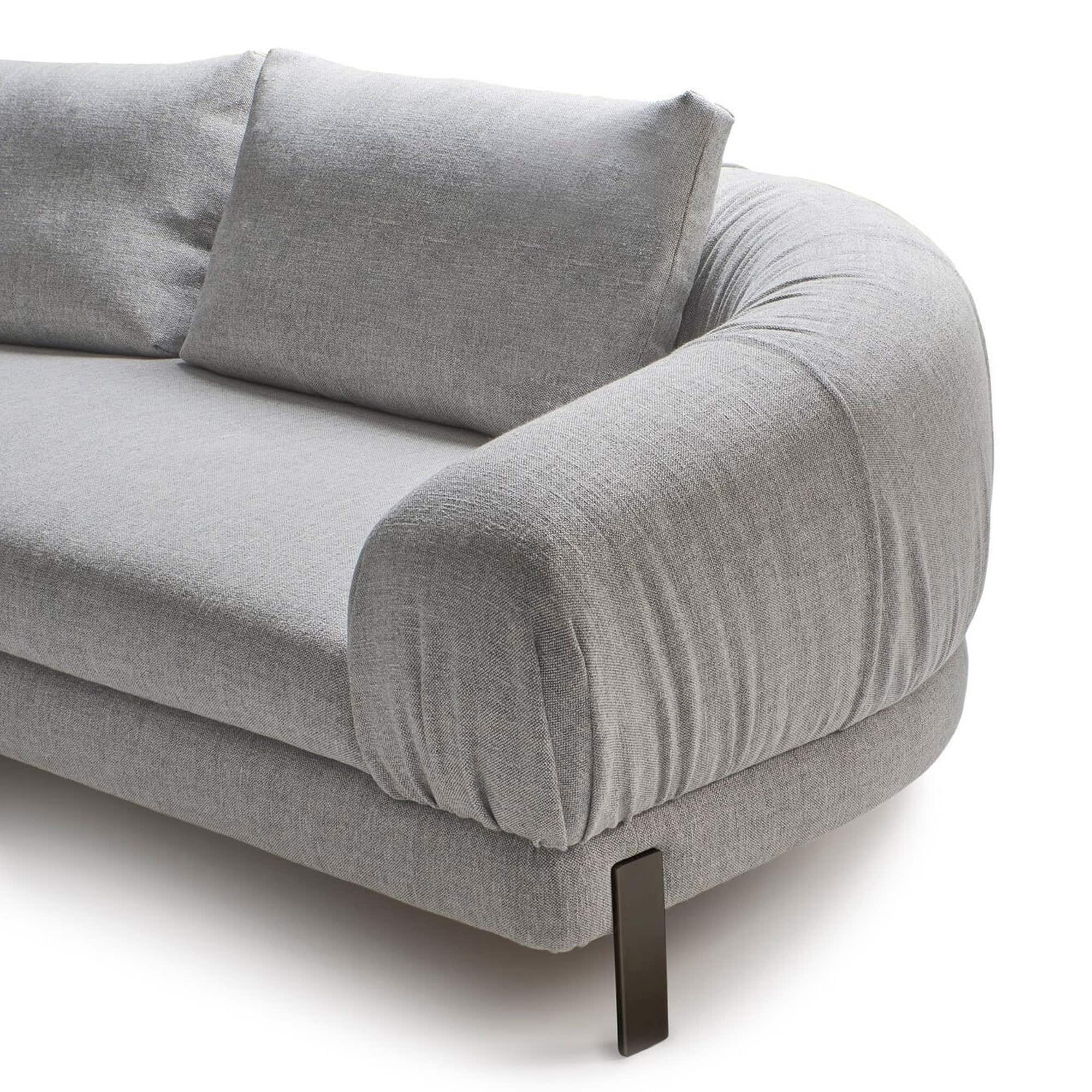 Close-up of the Crumble Modular Sofa armrest and cushions with fabric texture and metal leg detail.