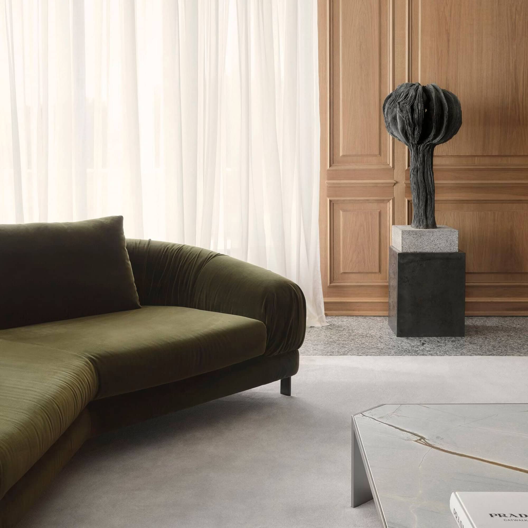 Crumble Modular Sofa in deep green velvet displayed in a modern living room.