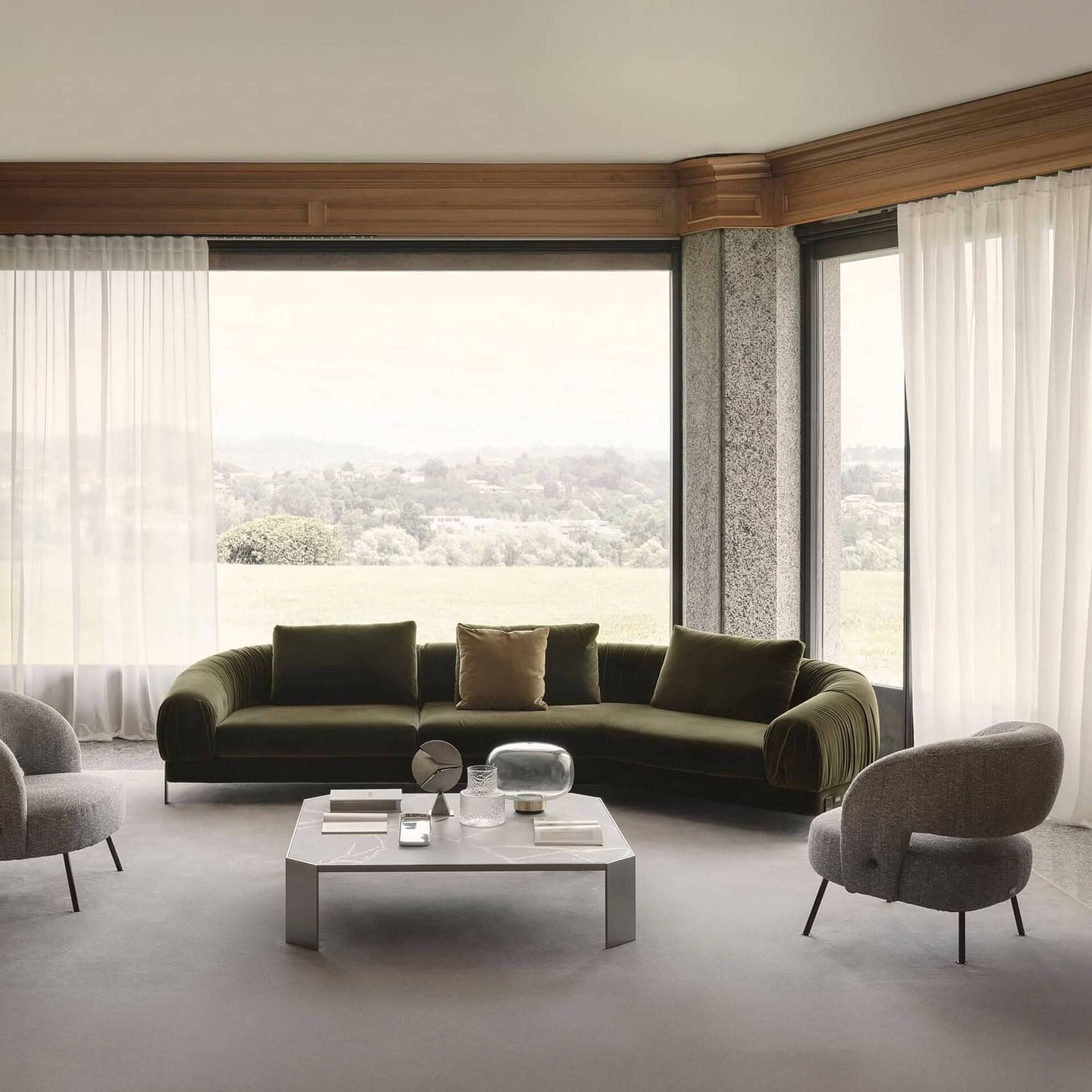 Large sectional configuration of Crumble Modular Sofa in a bright living space with panoramic windows.