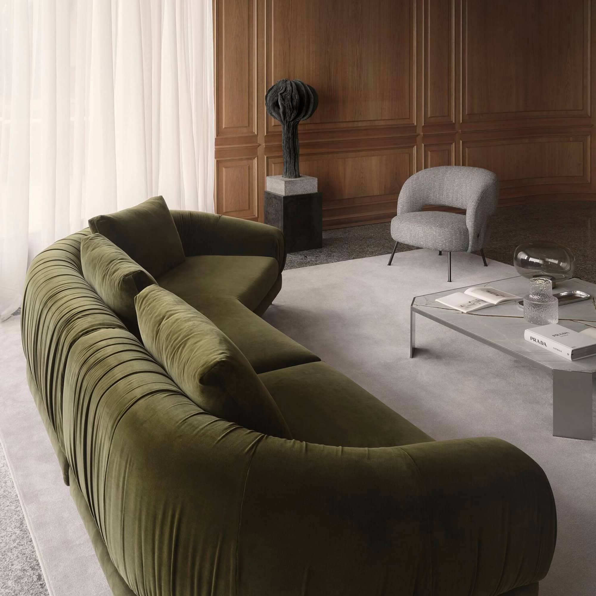 Angled view of the Crumble Modular Sofa in green velvet, styled with neutral décor.