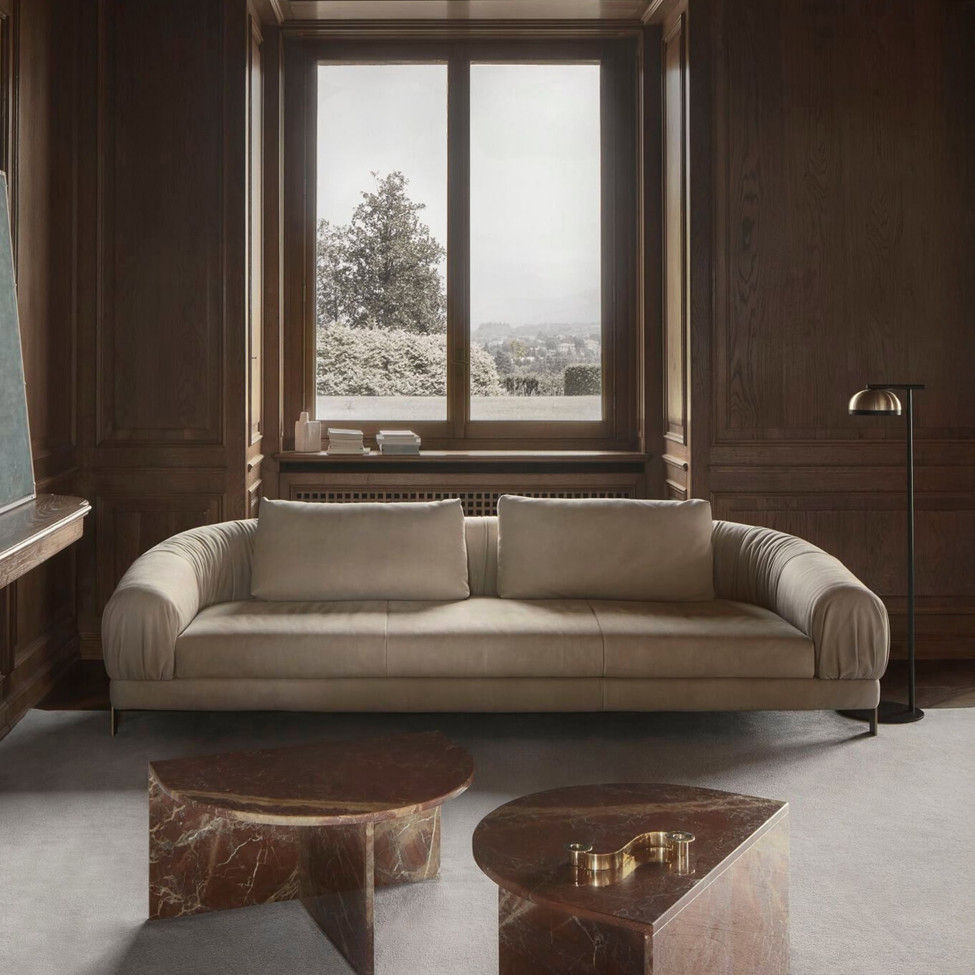 Crumble Modular Sofa in a luxurious dark interior with wood-paneled walls.