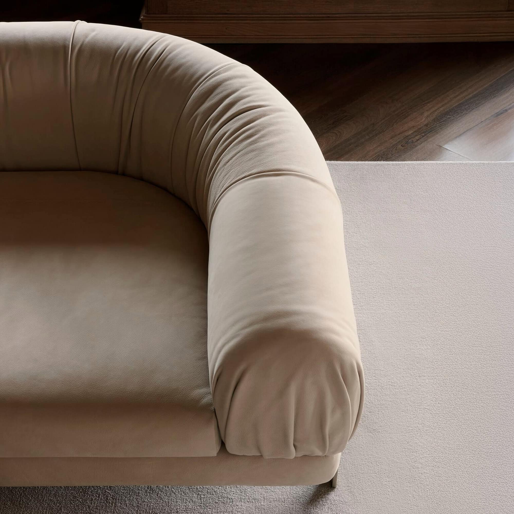 Detail view of the Crumble Modular Sofa’s rounded arm and plush upholstery.