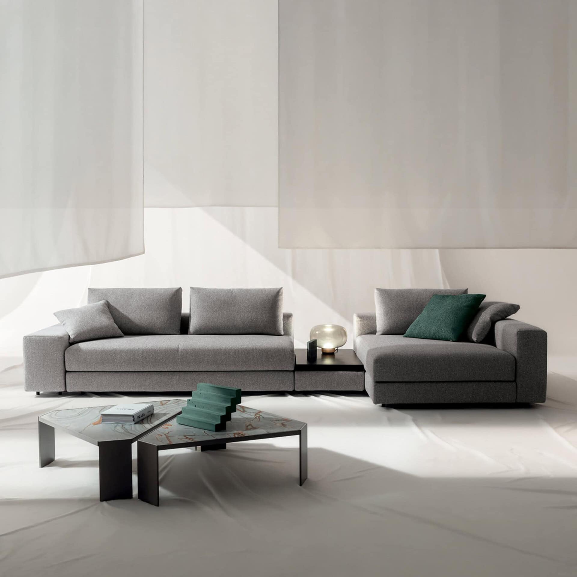 Modern Kuba Plain Modular Sectional Sofa in gray fabric. Perfect for contemporary living rooms.
