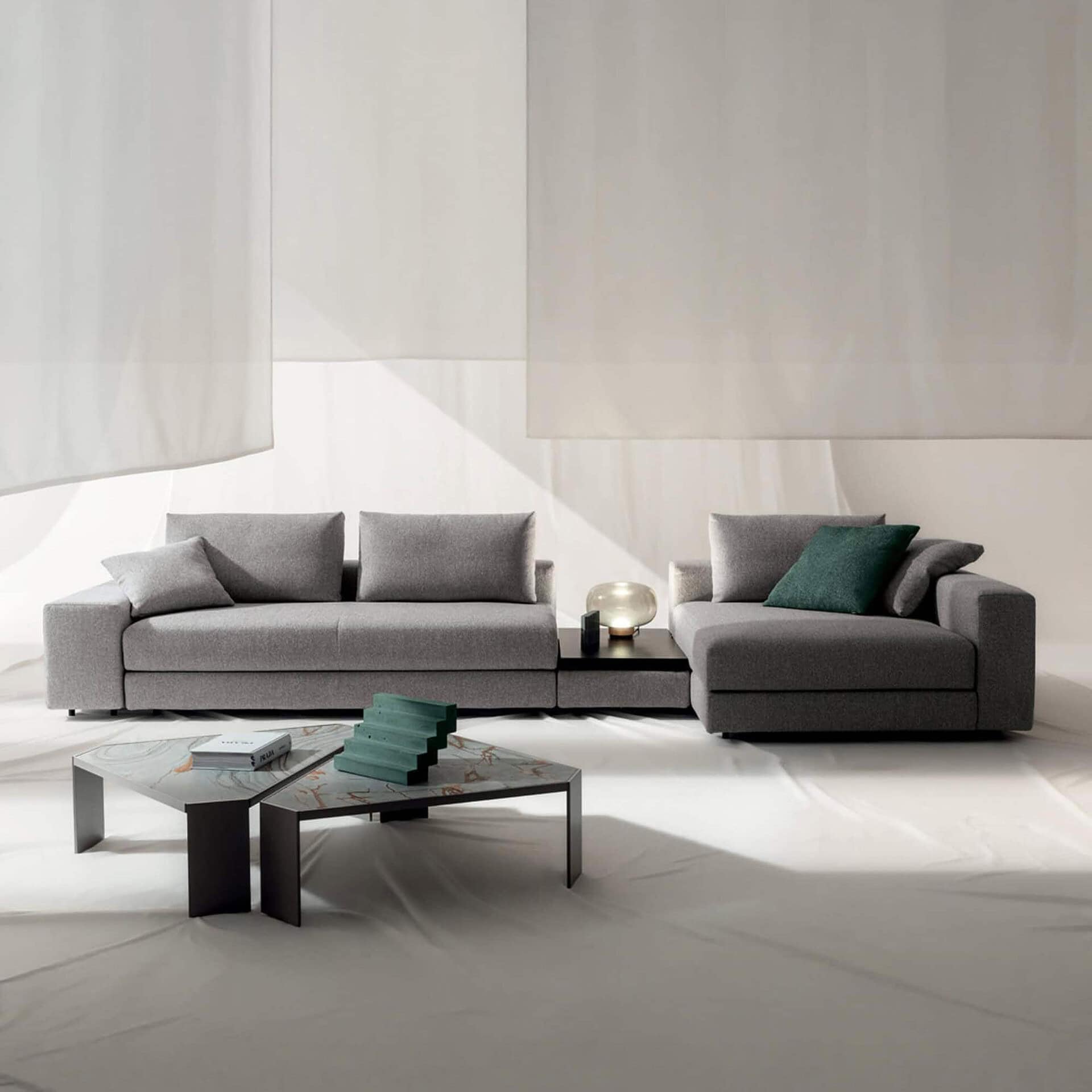Modern Kuba Plain Modular Sectional Sofa in gray fabric. Perfect for contemporary living rooms.