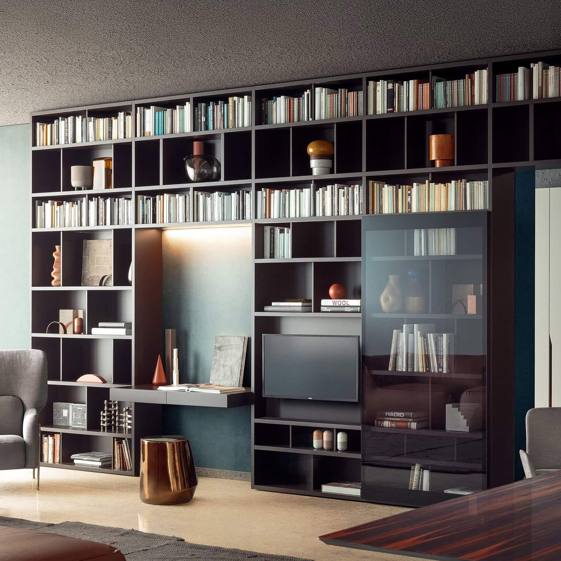 Contemporary living space featuring the Pianca Spazioteca Modular Wall Unit with TV integration and bookshelves
