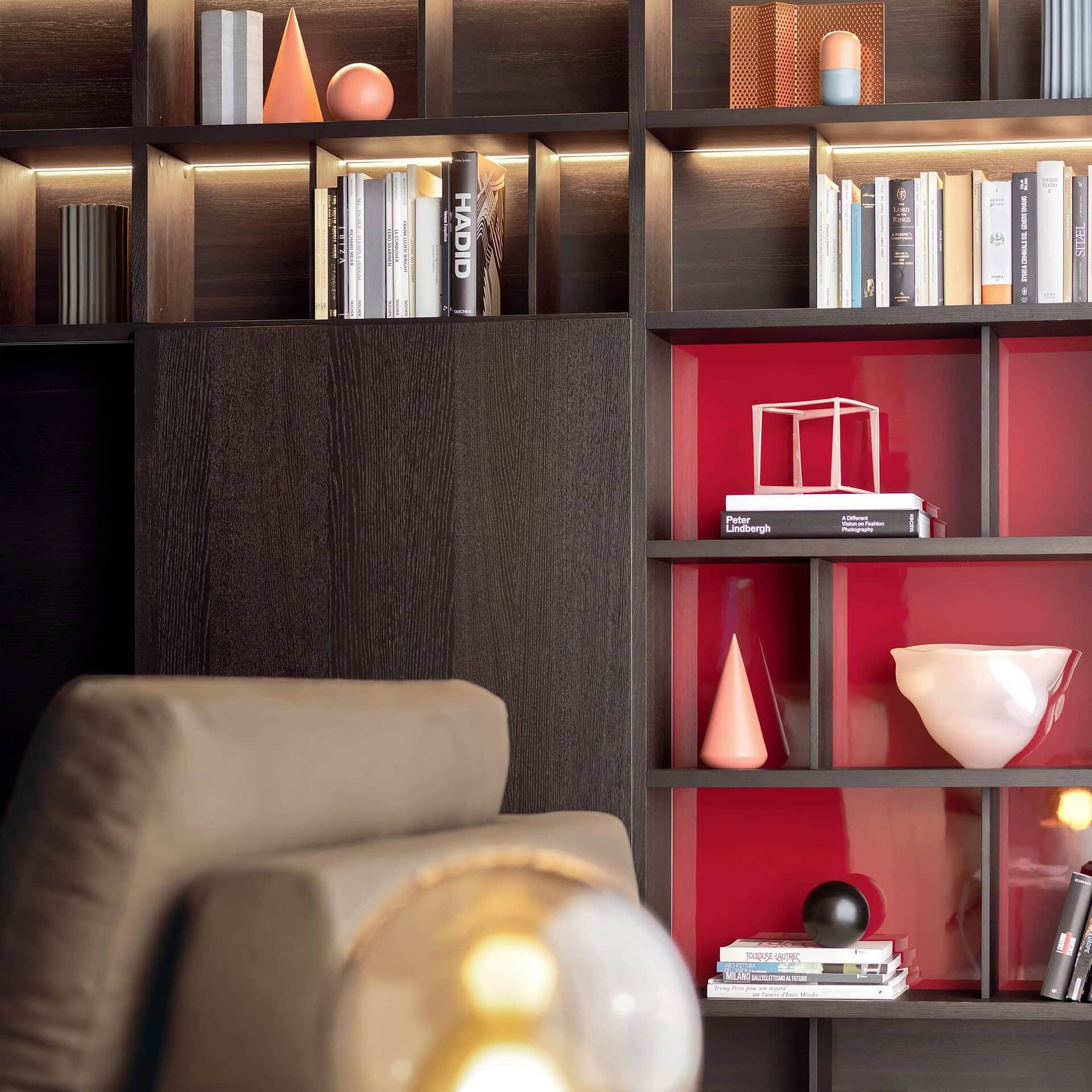 Detail of Pianca Spazioteca Modular Wall Unit with contrasting red shelving and wood finishes