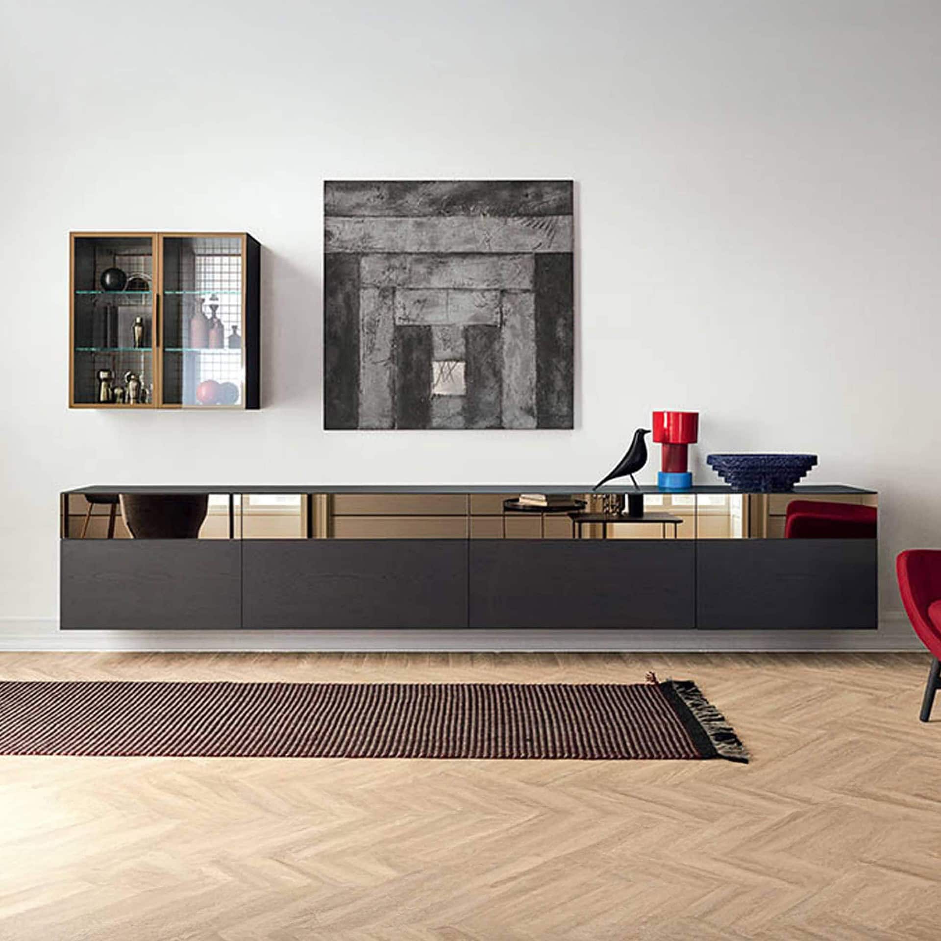 Sleek black modern sideboard with reflective gold accents, stylish decor, and abstract art in contemporary living space.