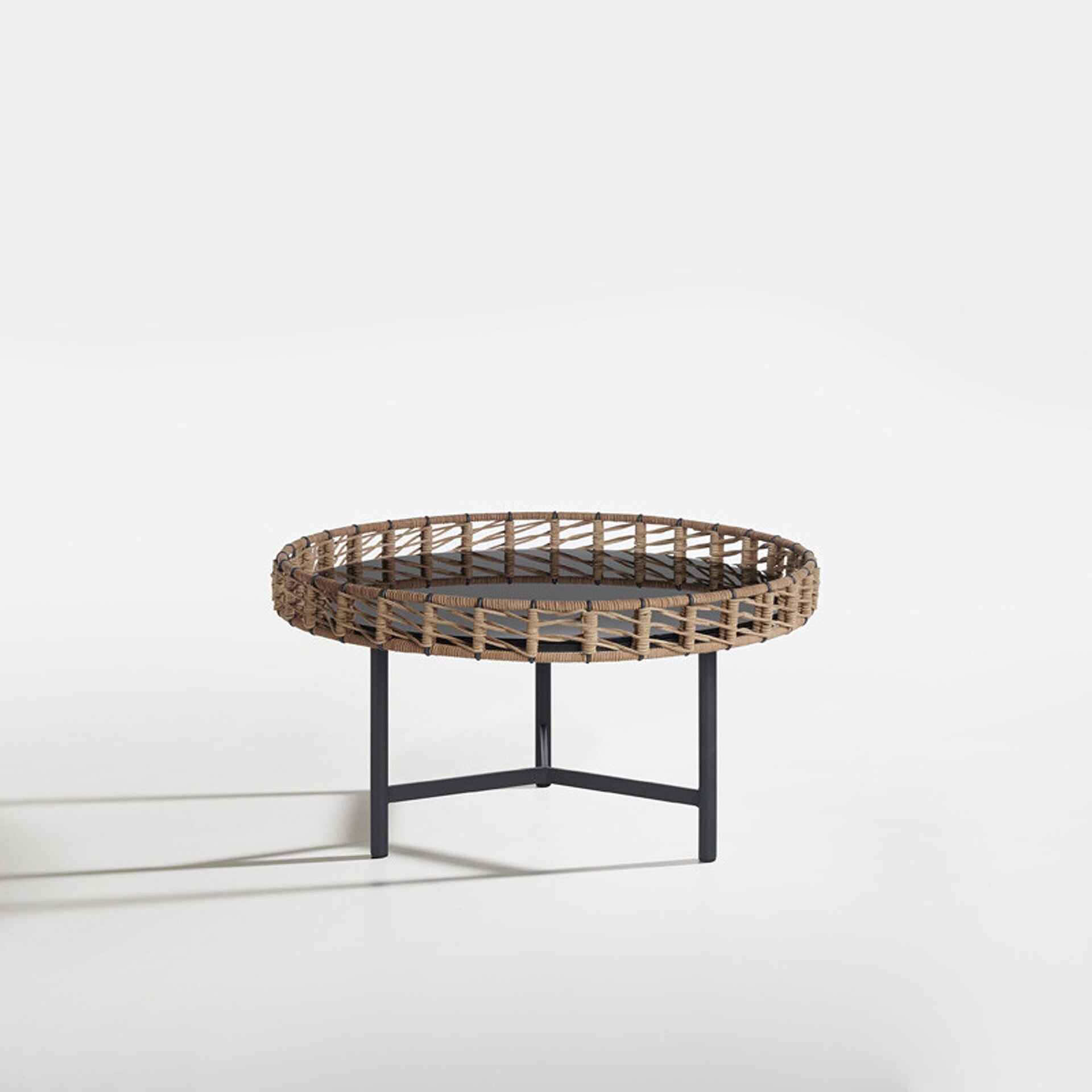 Stylish woven rattan coffee table with black metal legs, perfect for modern living spaces.
