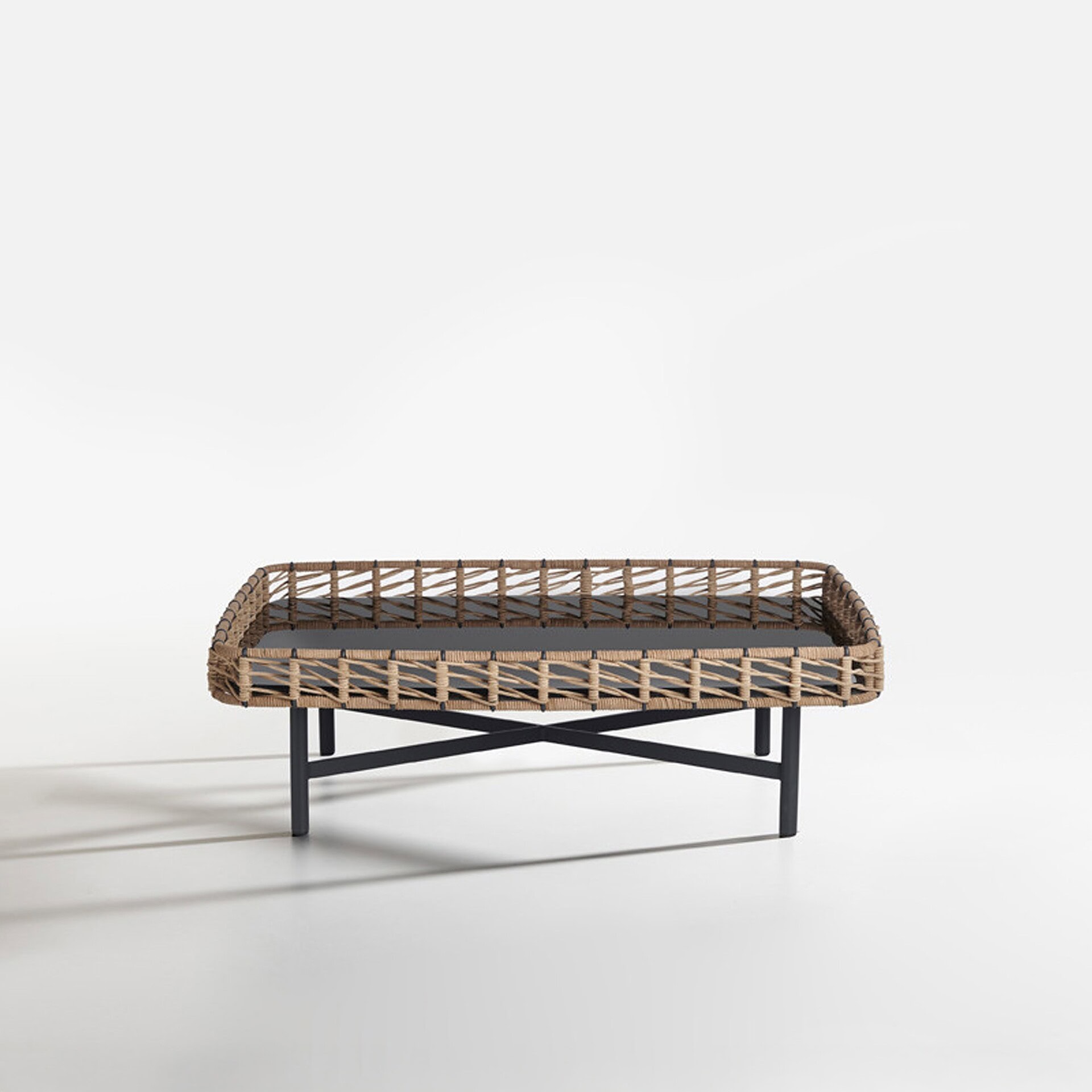 Woven rattan outdoor coffee table with black metal legs, stylish and durable design.