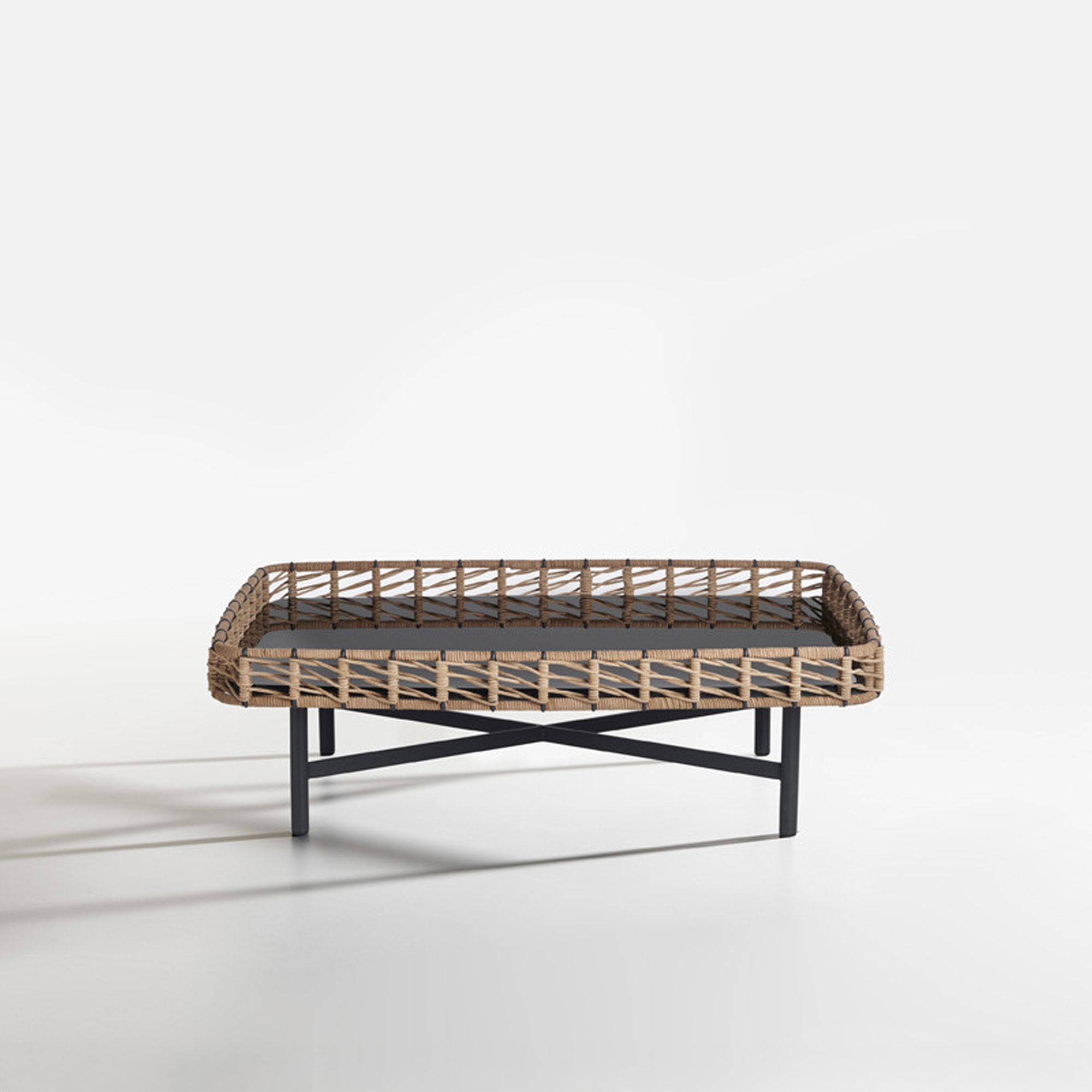 Woven rattan outdoor coffee table with black metal legs, stylish and durable design.