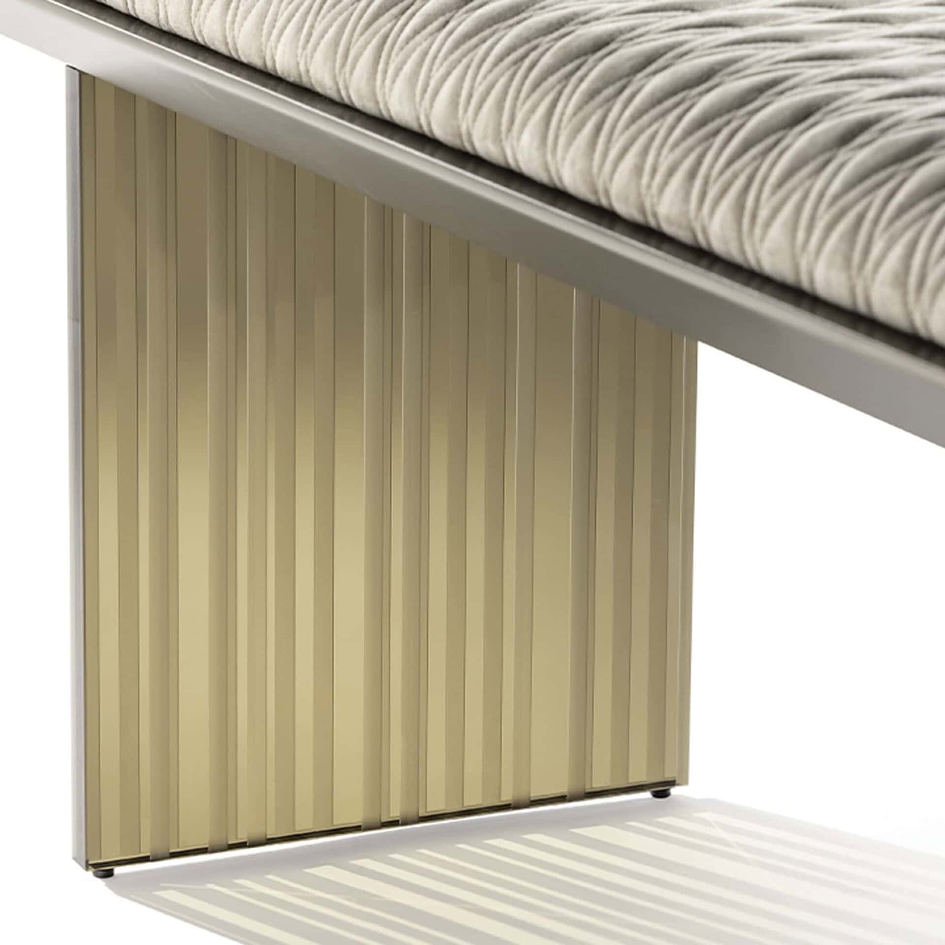 Close-up of the Reflex Monolite Bench showing ribbed glass leg and bronze frame detail