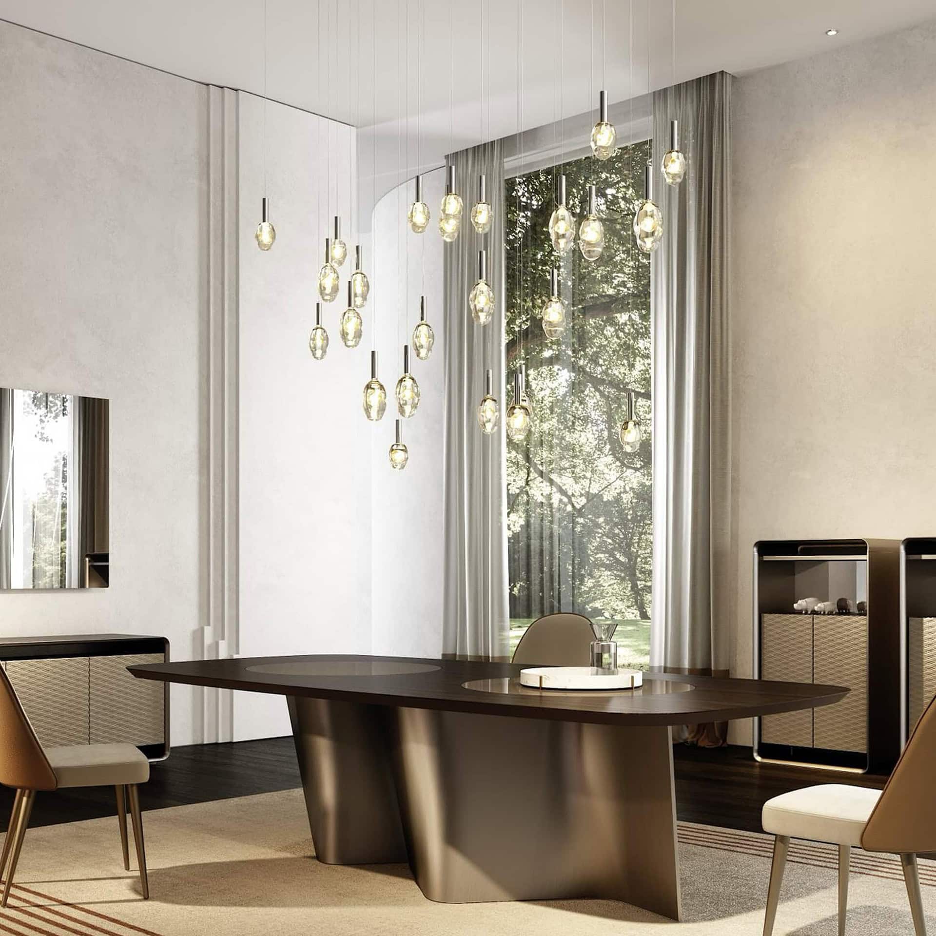 Dining room interior with the Sassi Murano Glass Chandelier featuring multiple gold-accented Murano glass pendants suspended above a modern wooden dining table.