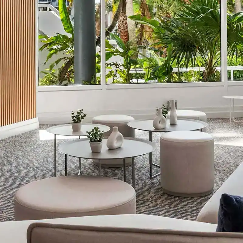 A Room With White Furniture And Plants