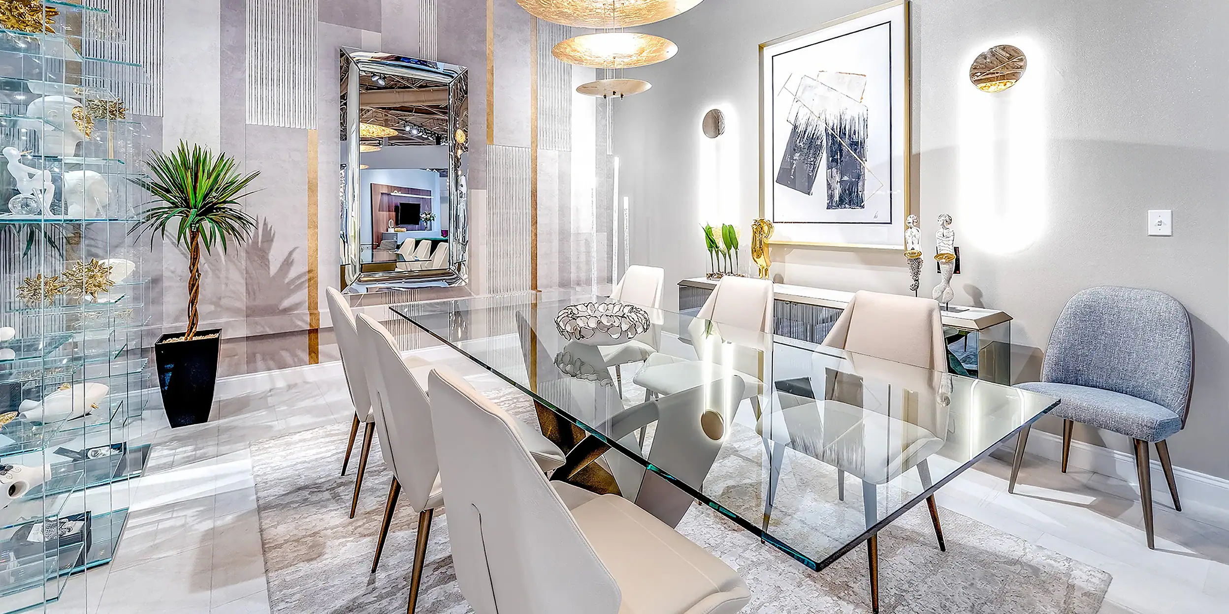 a dining room with a glass table and chairs