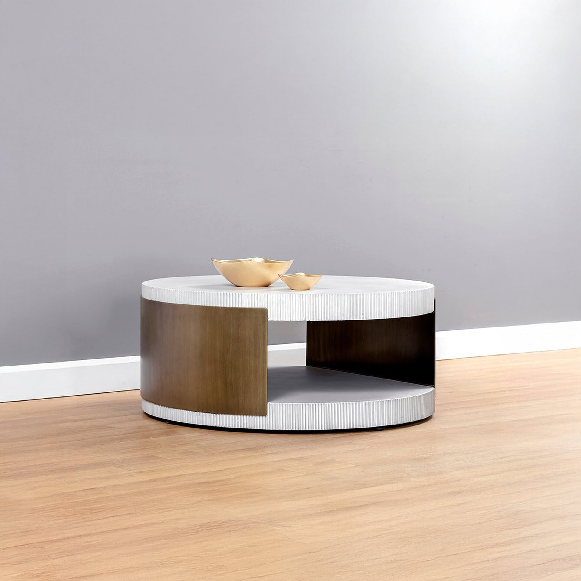 Modern oval coffee table with mixed wood and textured white surfaces for stylish living spaces.