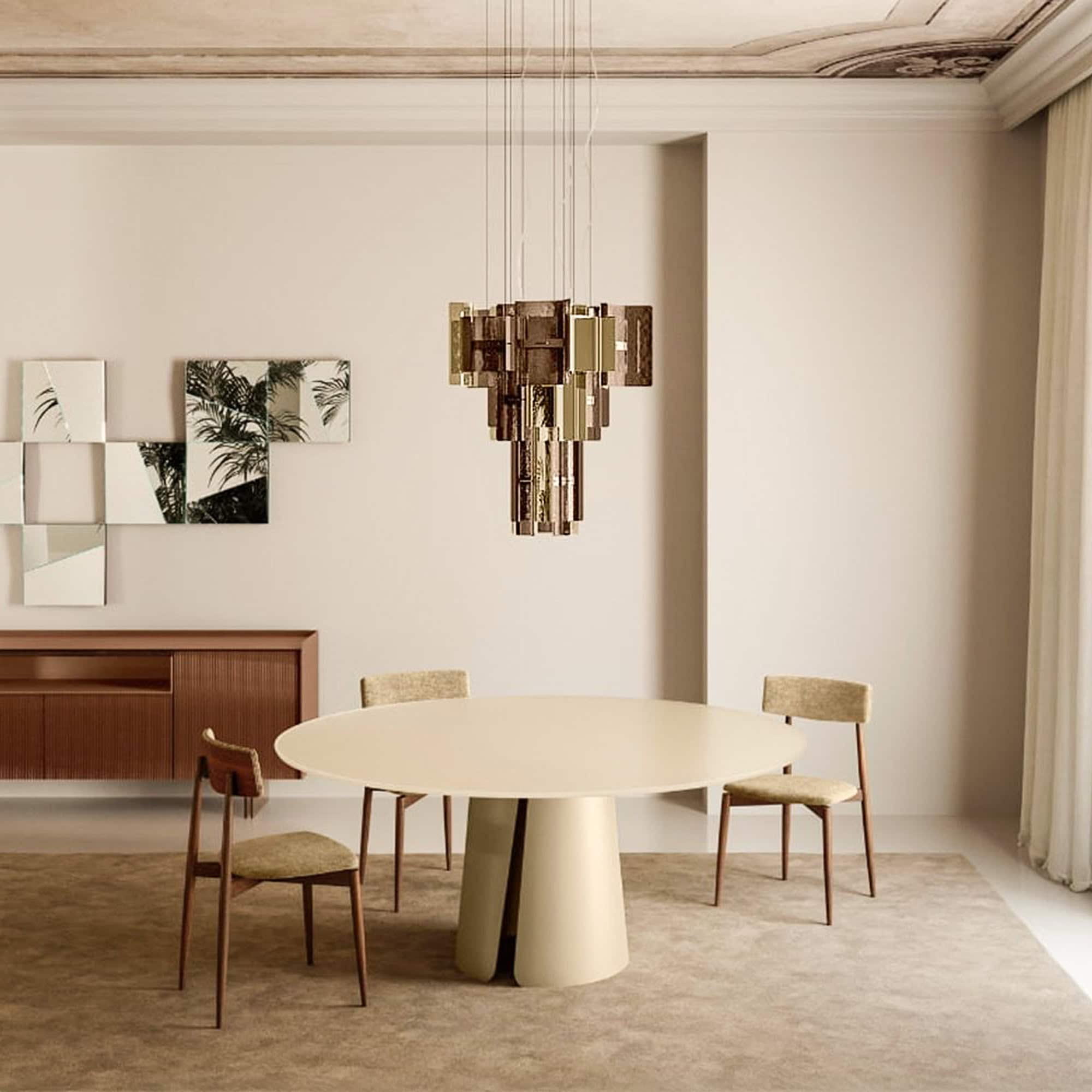 Dining room with Cathedral Glass Chandelier in smoked bronze finish above round dining table and chairs