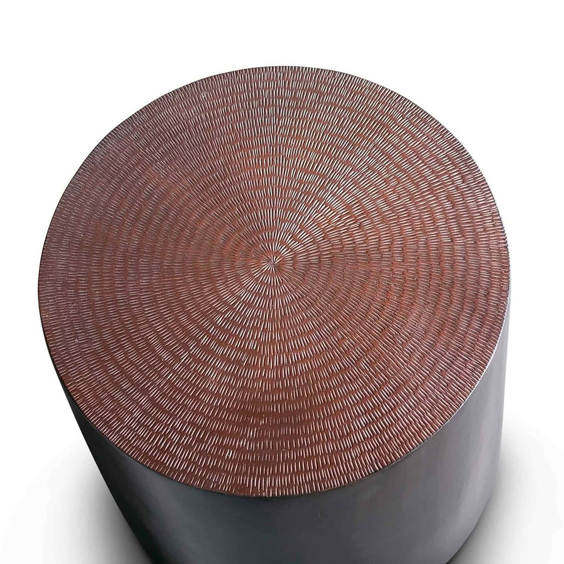 Elegant round side table with intricate textured wood top, perfect for modern living spaces.