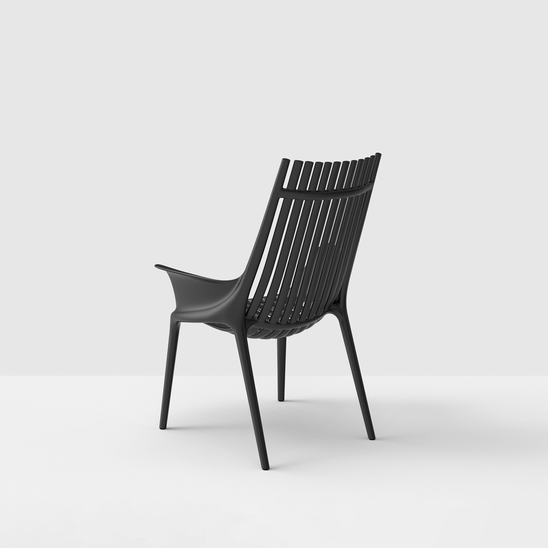 A black modern chair with a slatted backrest and integrated armrests, viewed from a three-quarter rear angle against a light grey background.