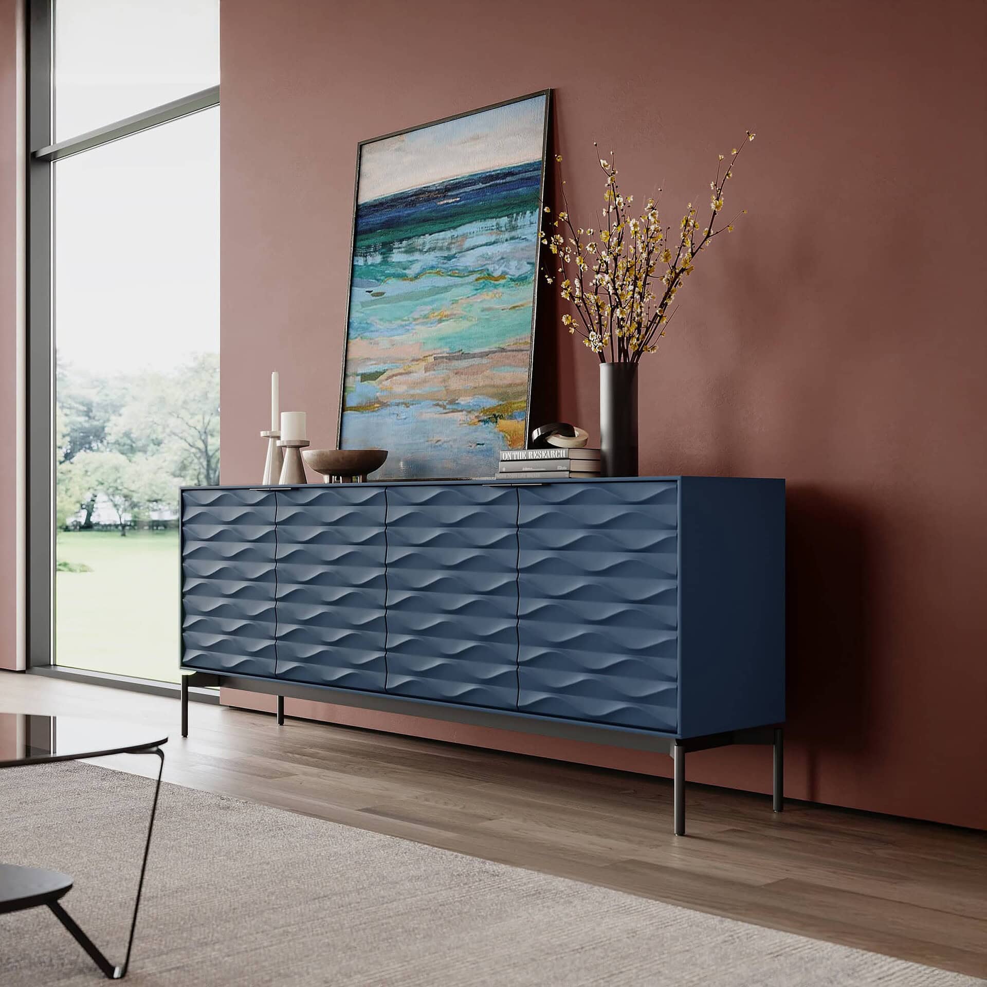 Contemporary blue textured sideboard with decorative items, wall art, and modern decor in a stylish living space.