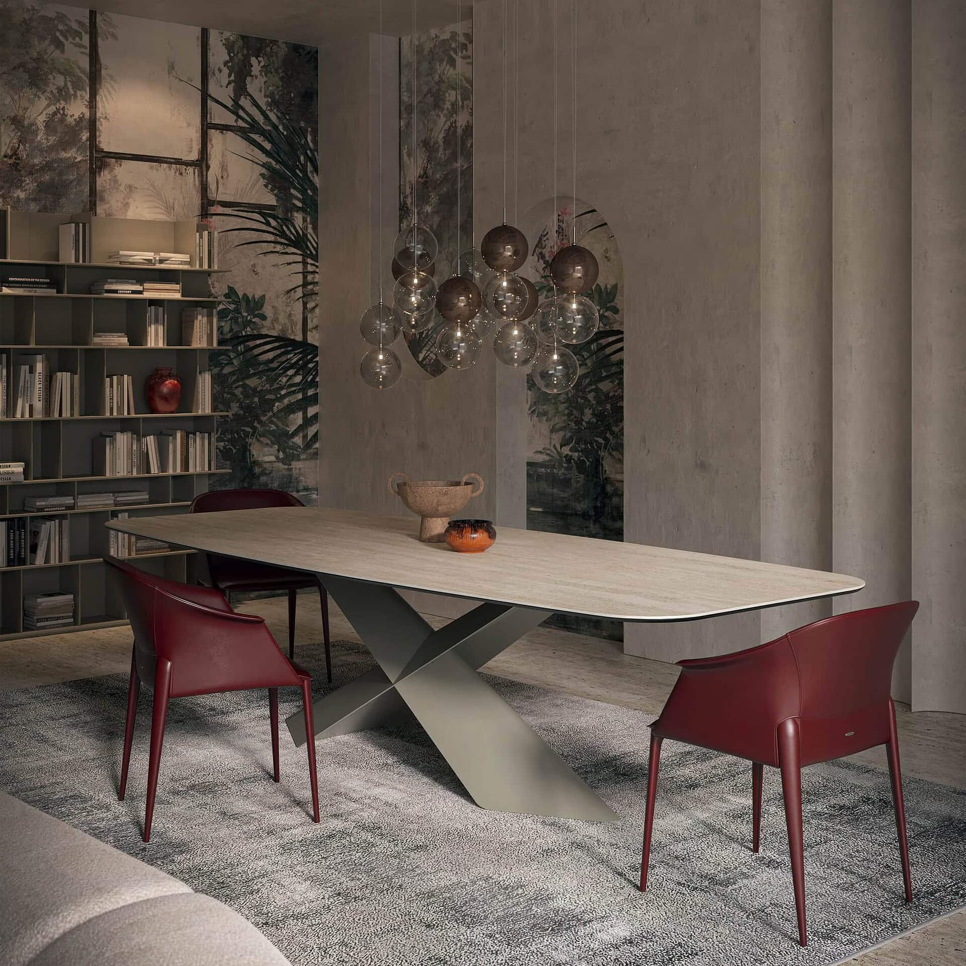 Contemporary dining room with modern table and stylish red chairs, featuring sleek design and elegant decor.