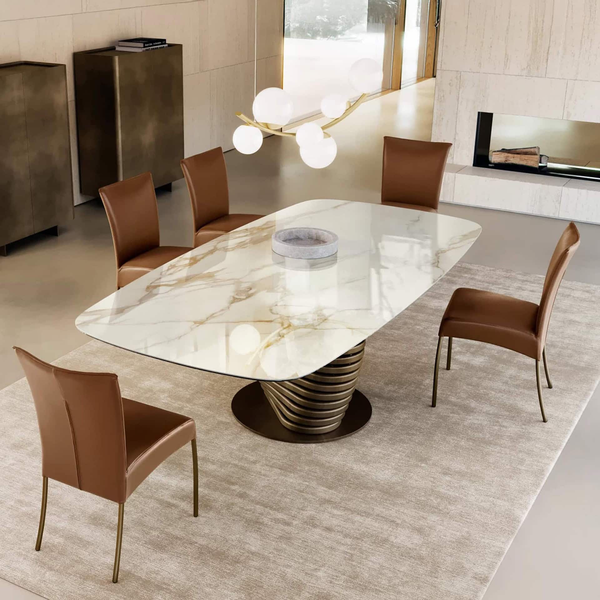 Alessia dining chairs in brown leather paired with a sculptural Rotolo dining table