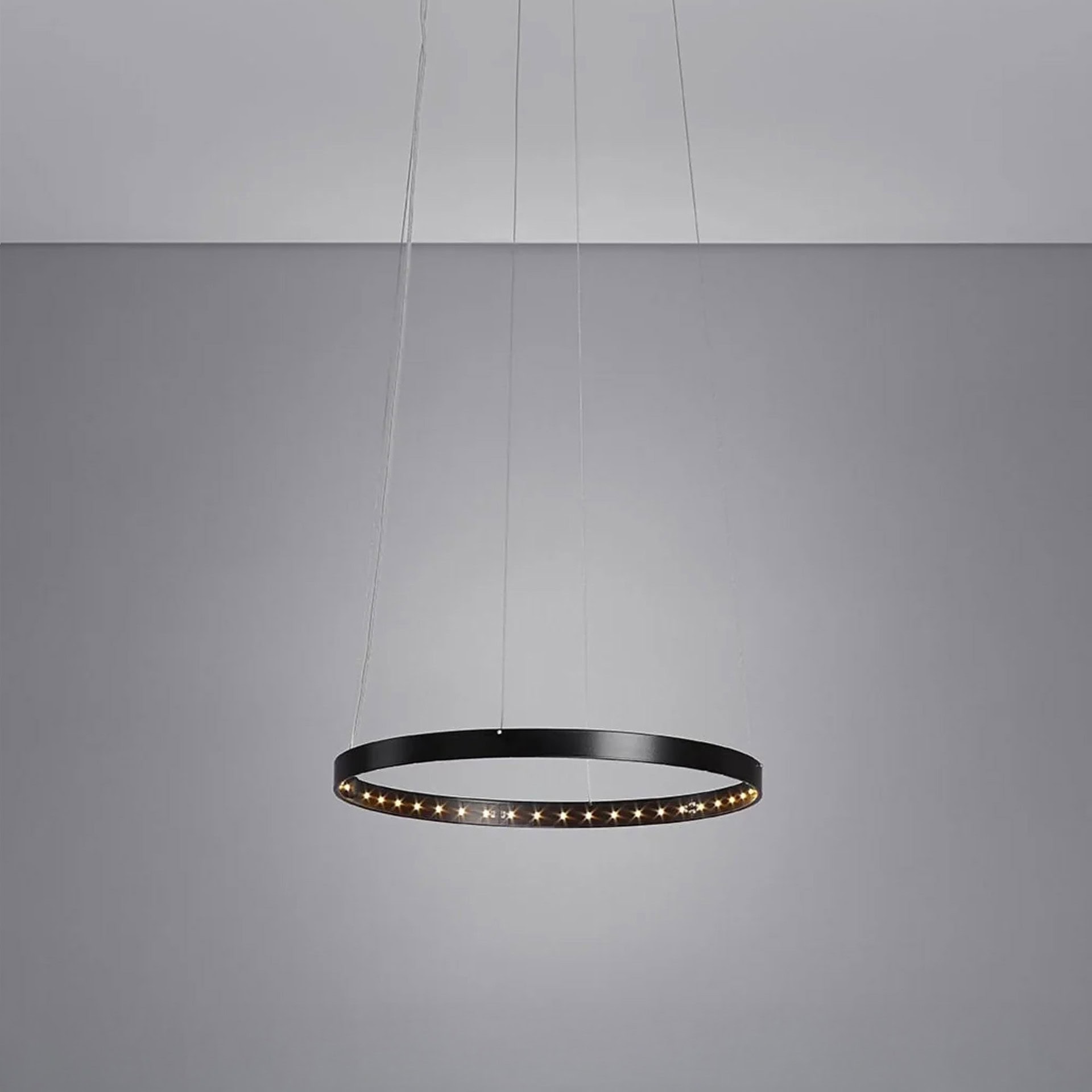Minimalist Circle 30 Pendant Light with slim circular profile, hanging in a clean modern interior.
