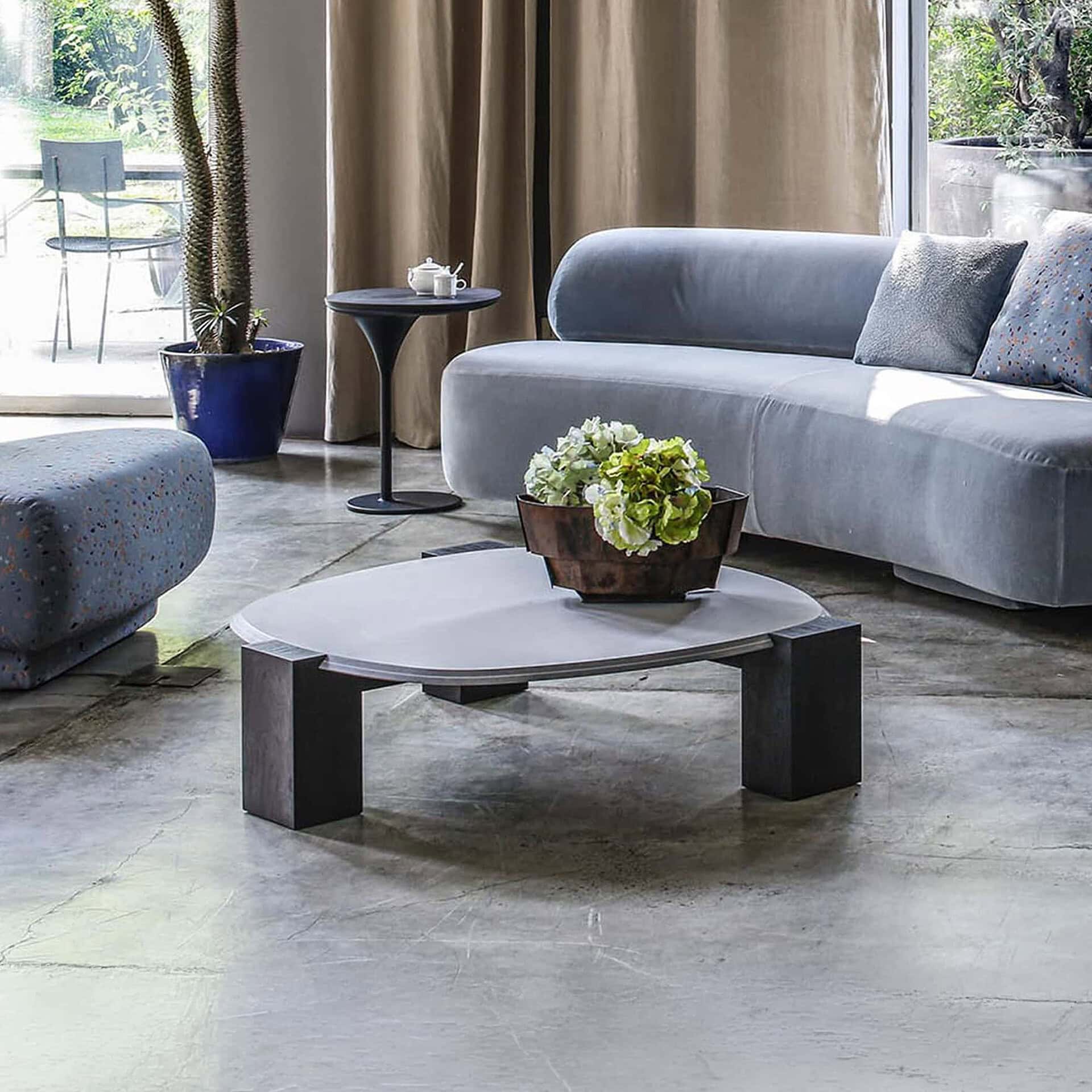 Sculptural Gogan coffee table with a unique design, perfect for modern living rooms. Crafted with hi.