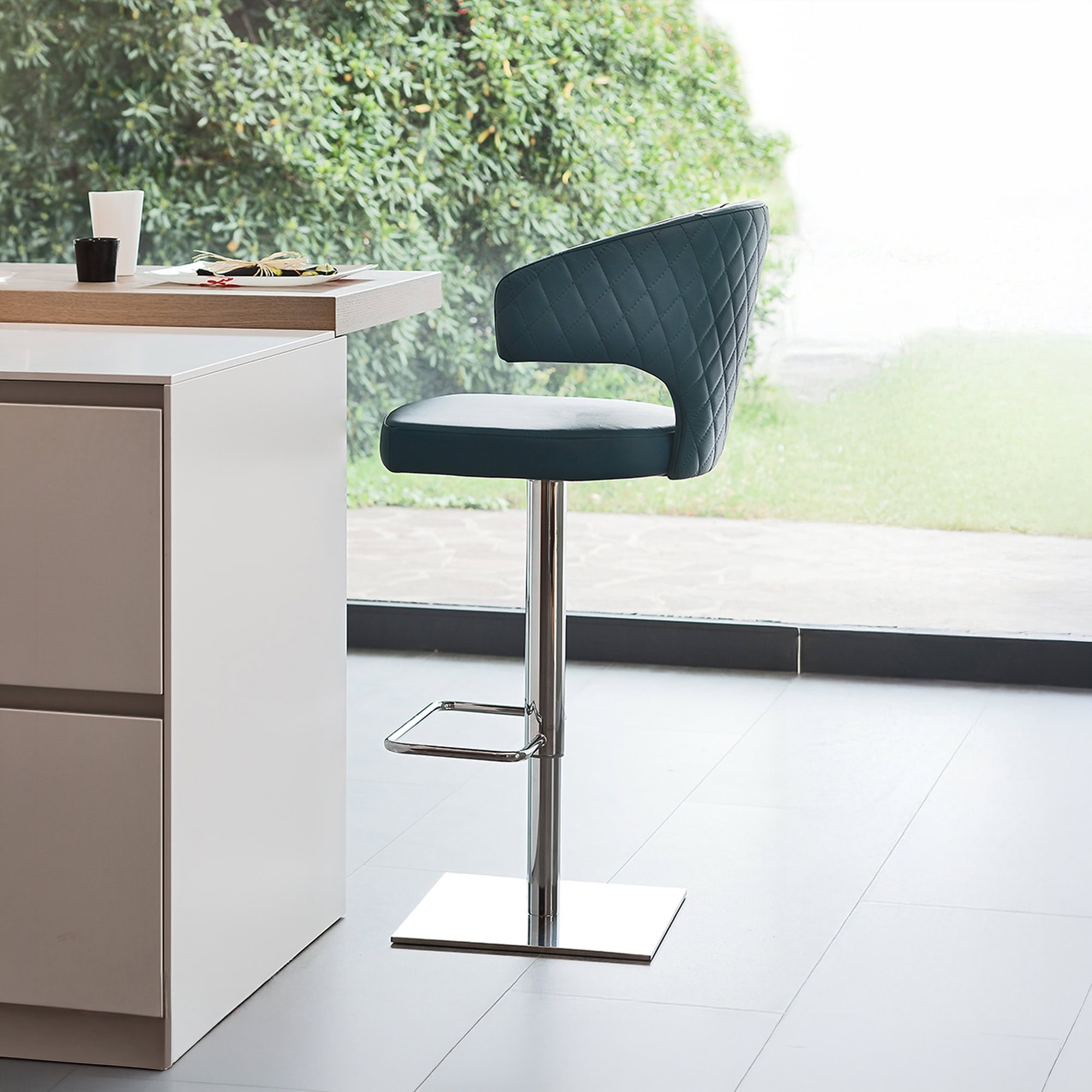 Stylish wingback upholstered stool with modern design and chrome base. Perfect for kitchen islands o.