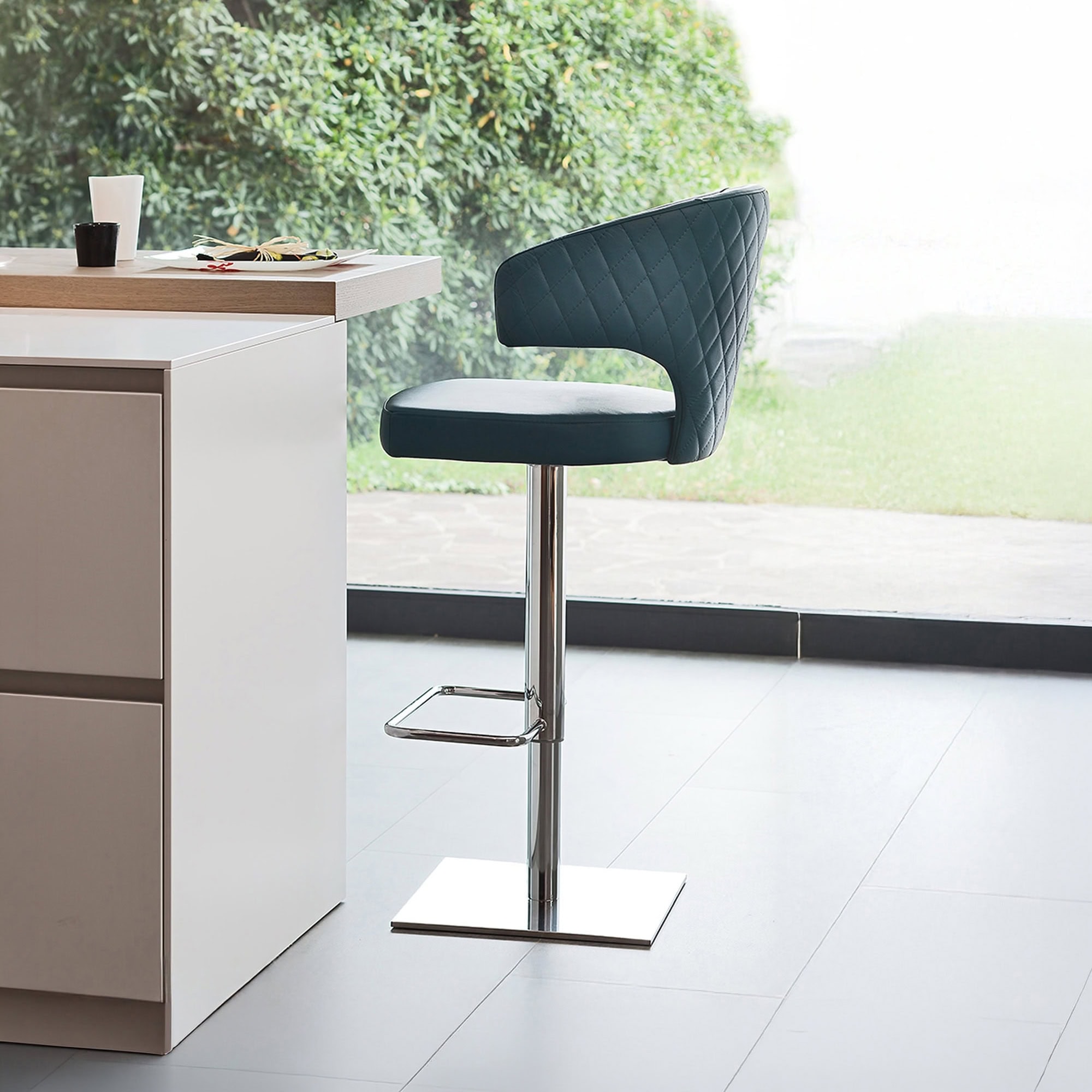 Stylish wingback upholstered stool with modern design and chrome base. Perfect for kitchen islands o.