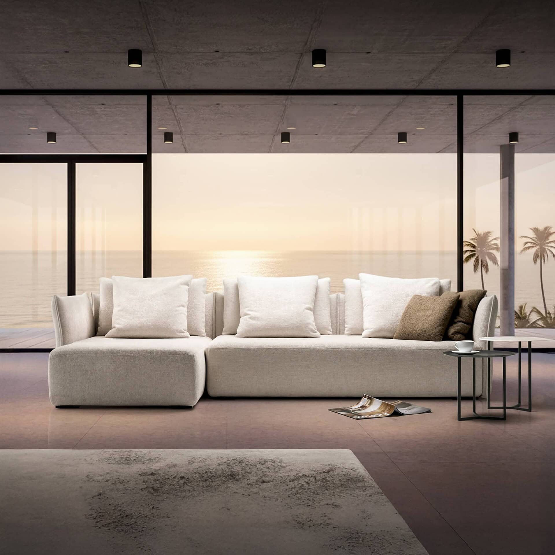 Le Savoie Modular Upholstered Sofa in a modern interior with mountain views, styled in light neutral fabric with oversized back cushions.